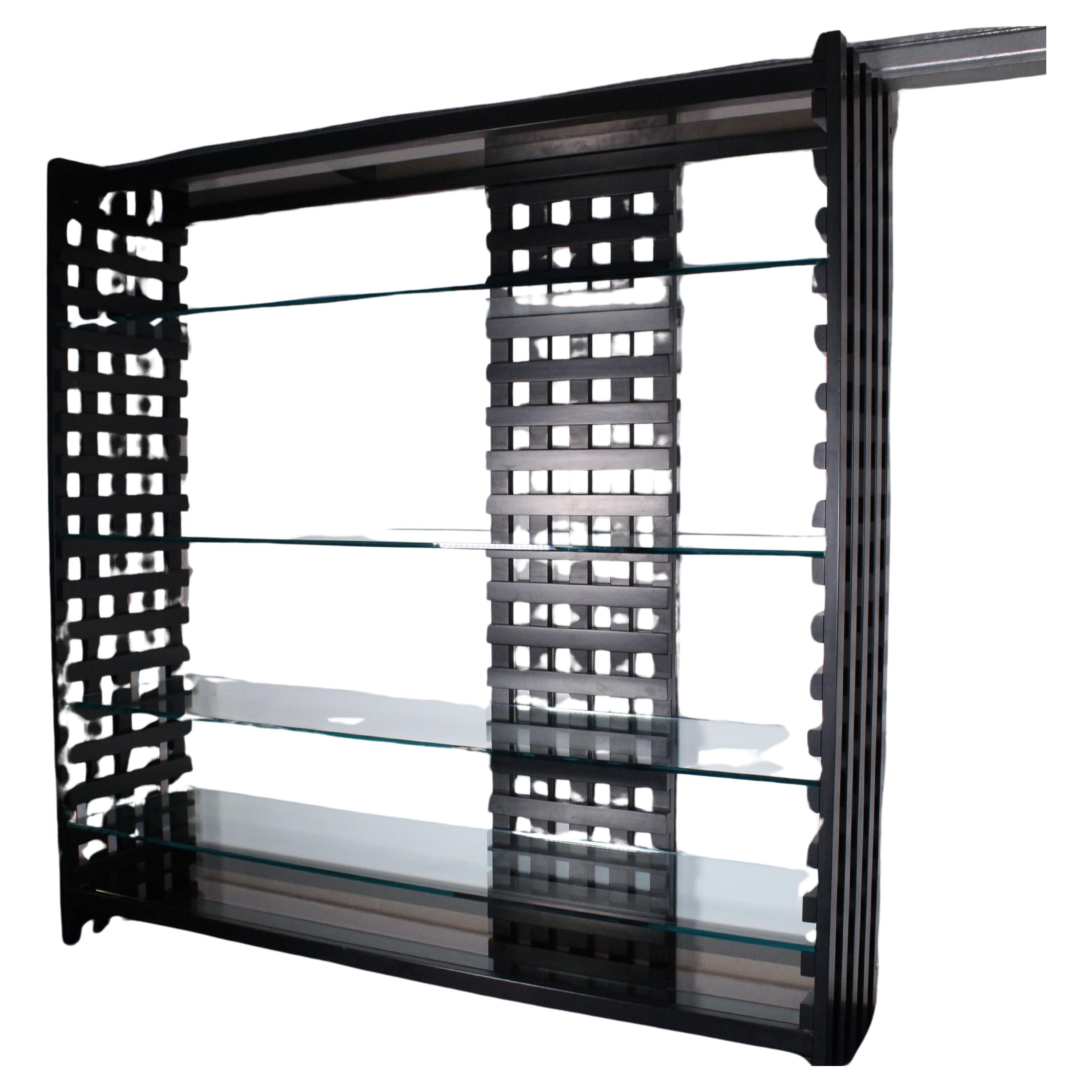 
Bookcase made of black painted wood and glass shelves. The bookcase is in Bauhaus style, very comfortable being of reduced height, measuring in fact only 183 cm. Very interesting object for a contemporary environment, with a touch of vintage