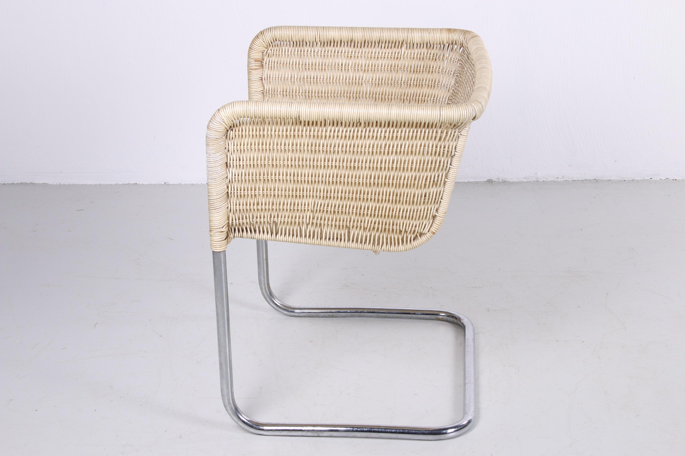 This is a set of 4 chairs, made of a tubular frame wrapped with reed.

This is model D43 from Bauhaus for Tecta swing chair. This set goes per 4

The chairs look Fine and have held up well over the years, 1 chair has a little damage on the