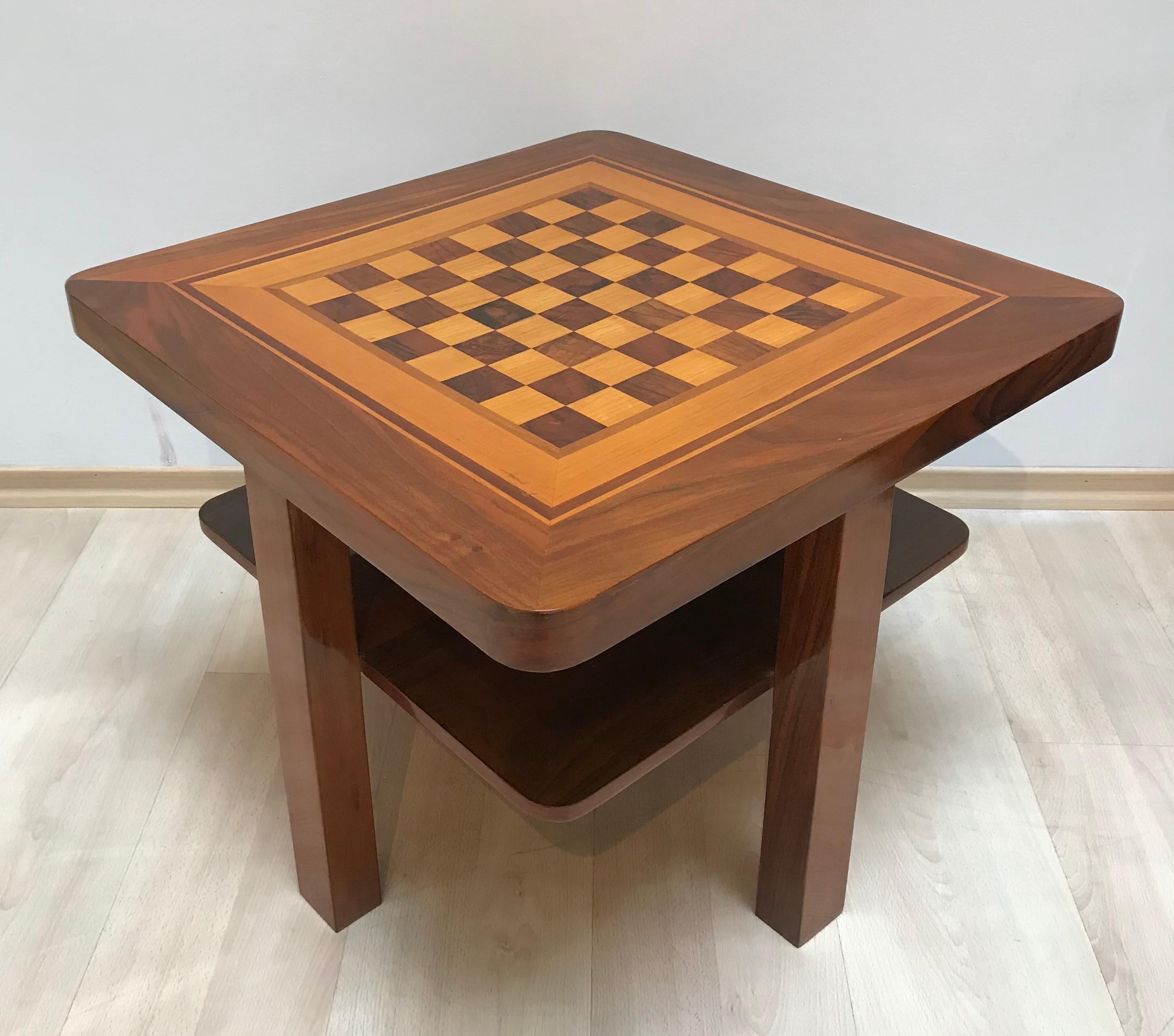 Beautiful original Bauhaus Chess Game Table from (East) Germany about 1930. 

Walnut veneer and solid wood on the frame. Marquetry of maple and walnut on the plate. 

The table has rounded edges and one floor underneath the chess field. 
It has been