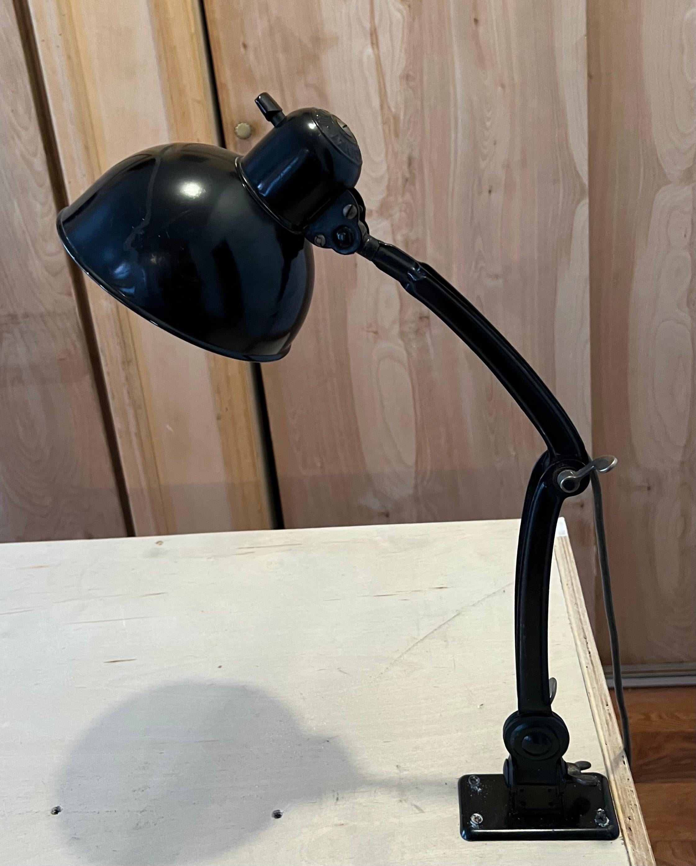 Early German Modernist / Bauhaus clamp lamp for desk, table or wall, Model # 6716 by Christian Dell and manufactured by Kaiser Idell, circa 1930. A timeless work of industrial design and art that still maintains its role in form and function today.