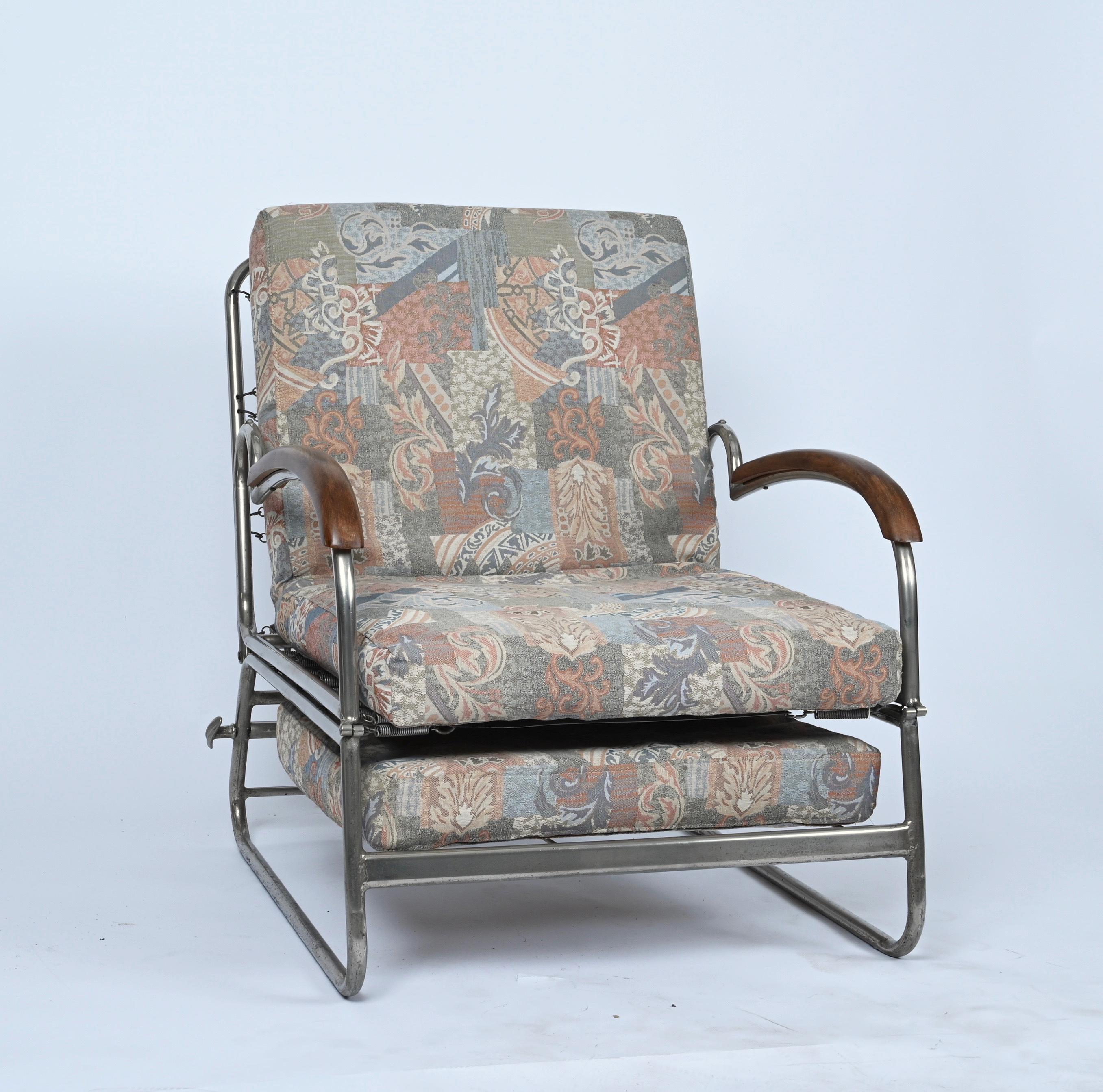 Stunning adjustable Bauhaus curved chromed steel with walnut wood armrests bed armchair. This fantastic piece was designed in Germany during the 1930s and it is attributed to Marcel Breuer. 

The structure is just incredible, chromed steel metal