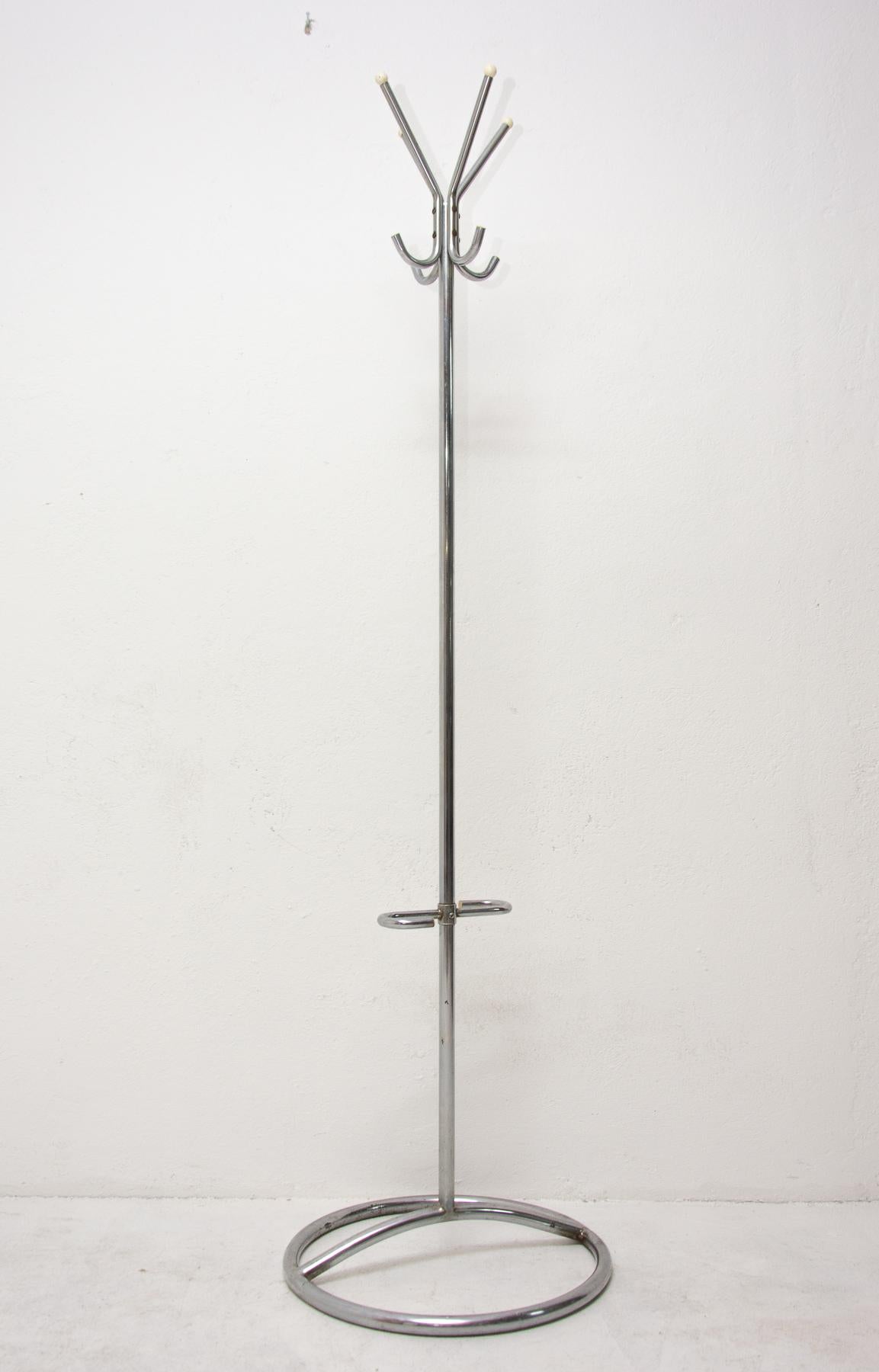 A beautiful example of Bohemian pre-war functionalism represents this model of coat rack. This hanger was designed and made probably by Gottwald or Slezák company in Bohemia in the 1930s.
It features a full-chrome structure with round tips at the