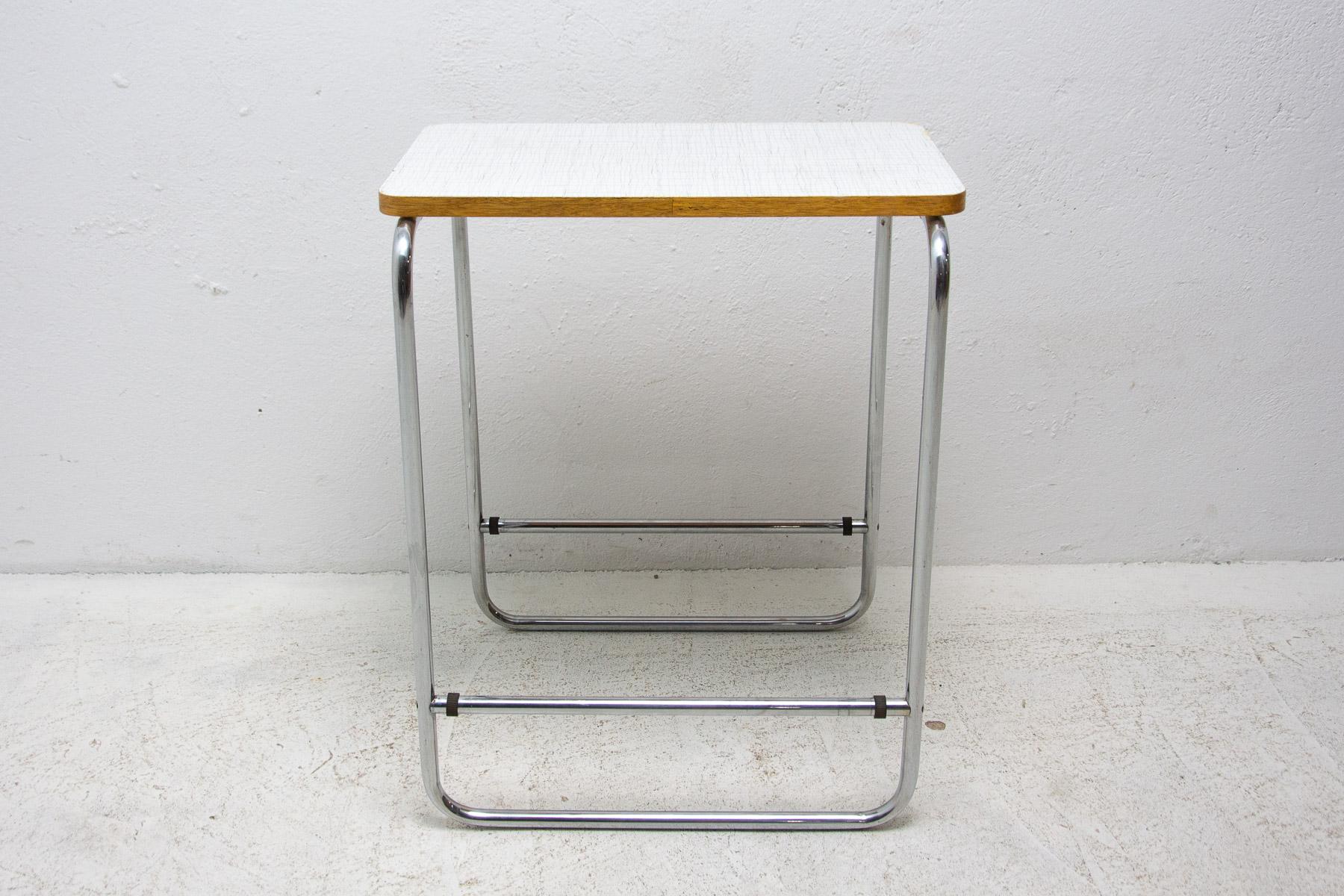 Chrome side table with formica plate in the style of Marcel Breuer, made during the Bauhaus period in the former Czechoslovakia, most likely in the 1930s

It features a chromed construction and a formica top plate.

The table is generally in