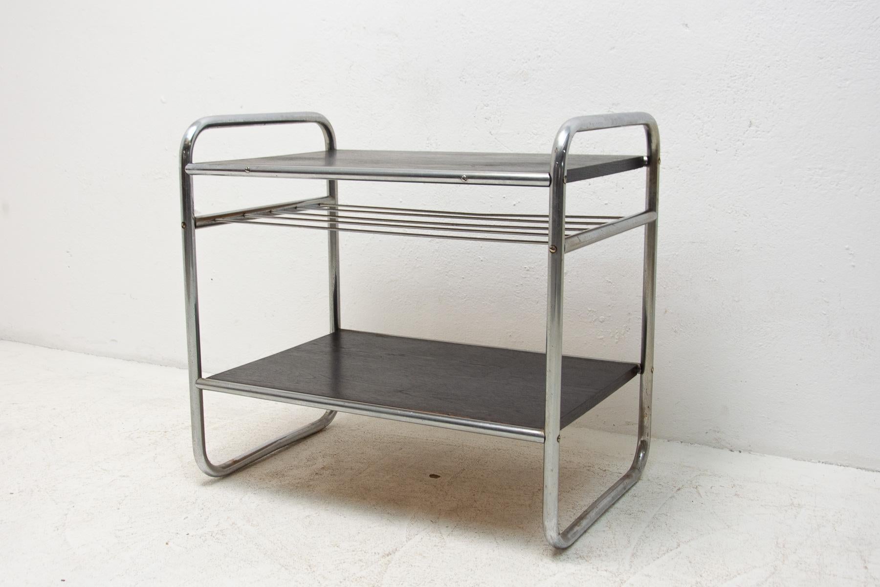 Chrome side table, made during the Bauhaus period in the former Czechoslovakia, most likely in the 1930s

It features a chrome construction and oak panels.

The table is in very good condition, the panels have been be renovated.
 