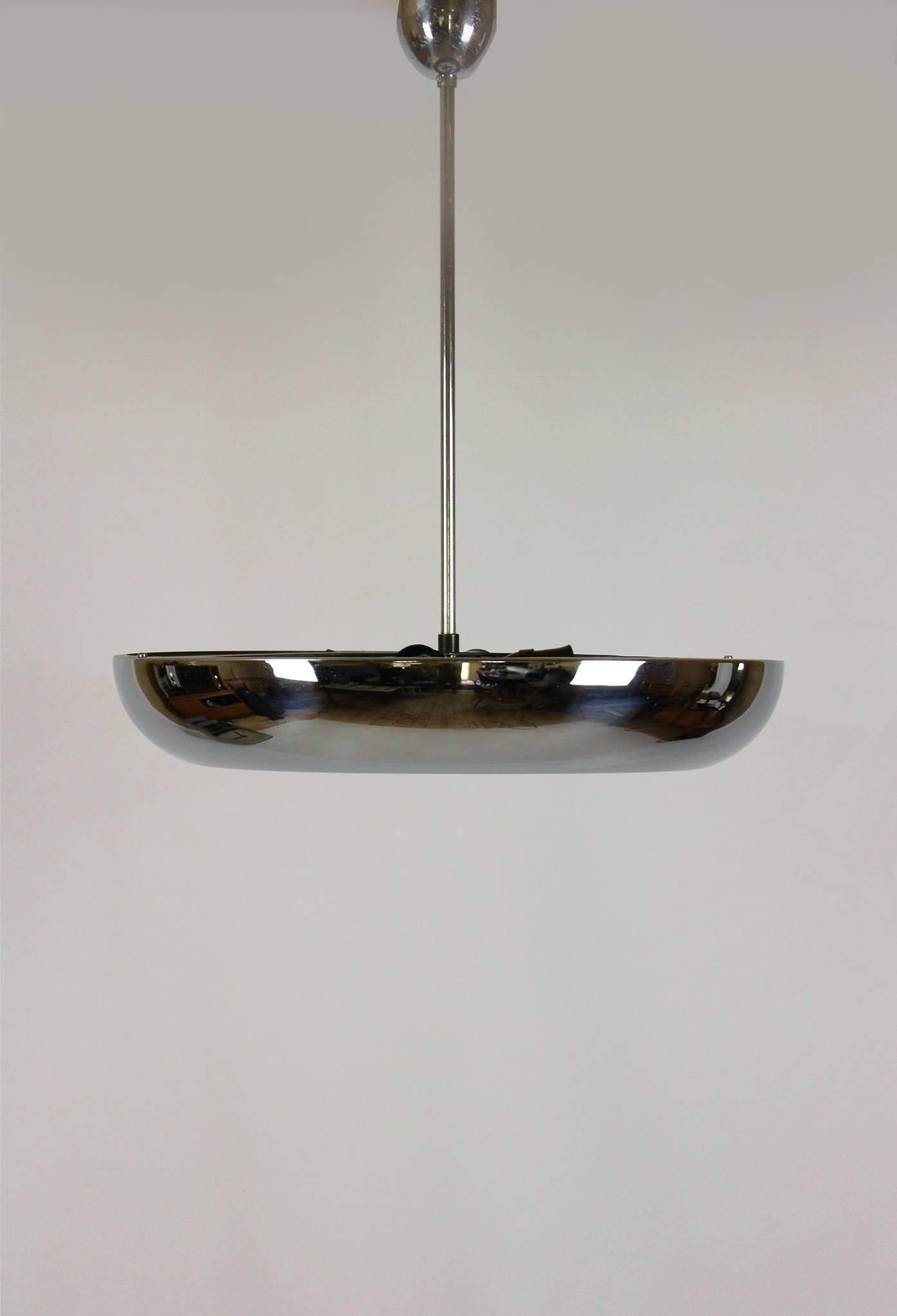 Bauhaus UFO pendant lamp designed by Josef Hurka for Napako and produced in the 1930s.
Made of chromed metal and glass, features four bakelite lampholders which hold E27 bulbs.
In a original vintage condition.