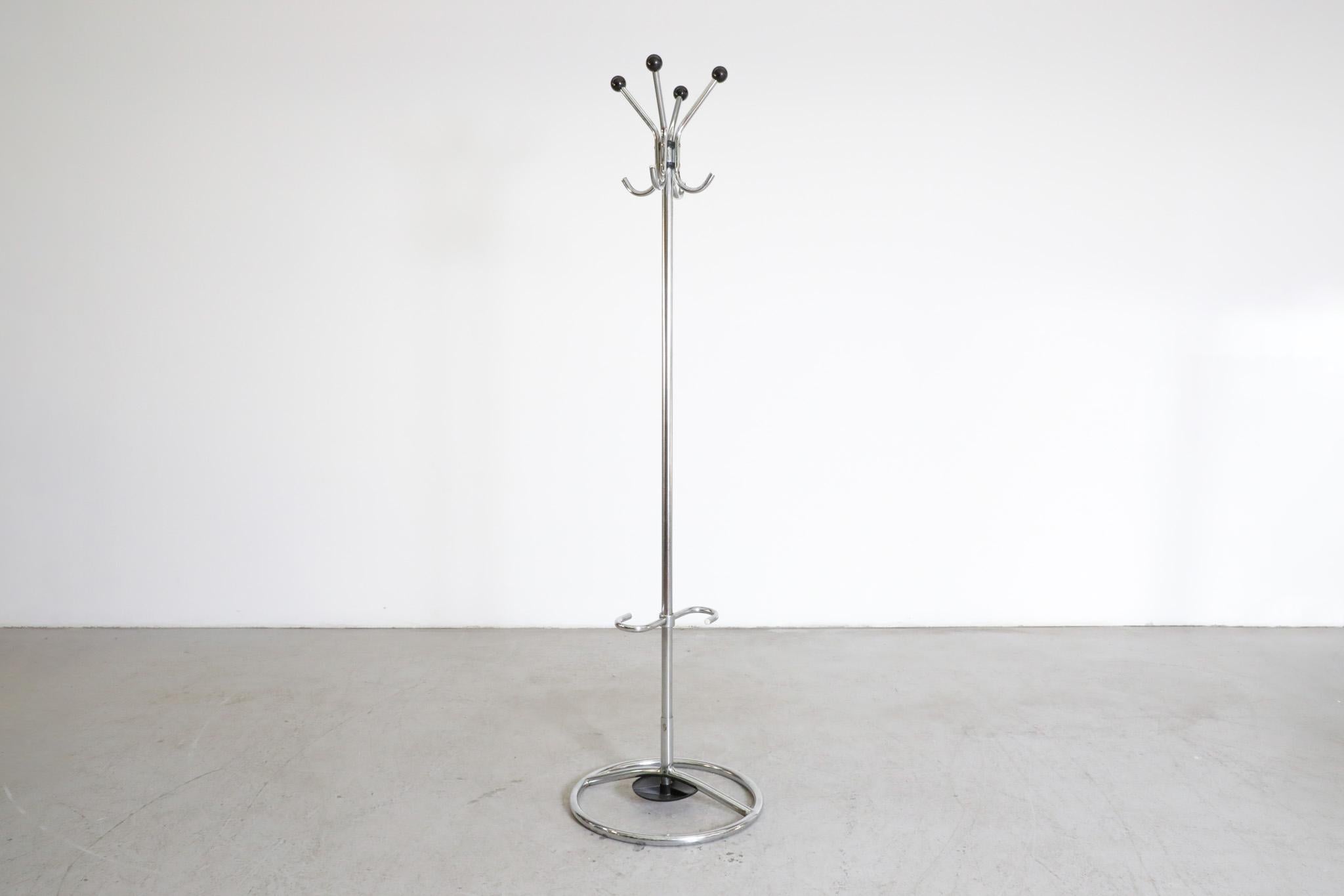 Bauhaus, black and chrome coat stand attributed to famed Czech designer Slezák, 1930s. This standing coat rack has hooks at the top for coats and bags with a curved umbrella stand at the base. Beautifully simplistic design. In good original