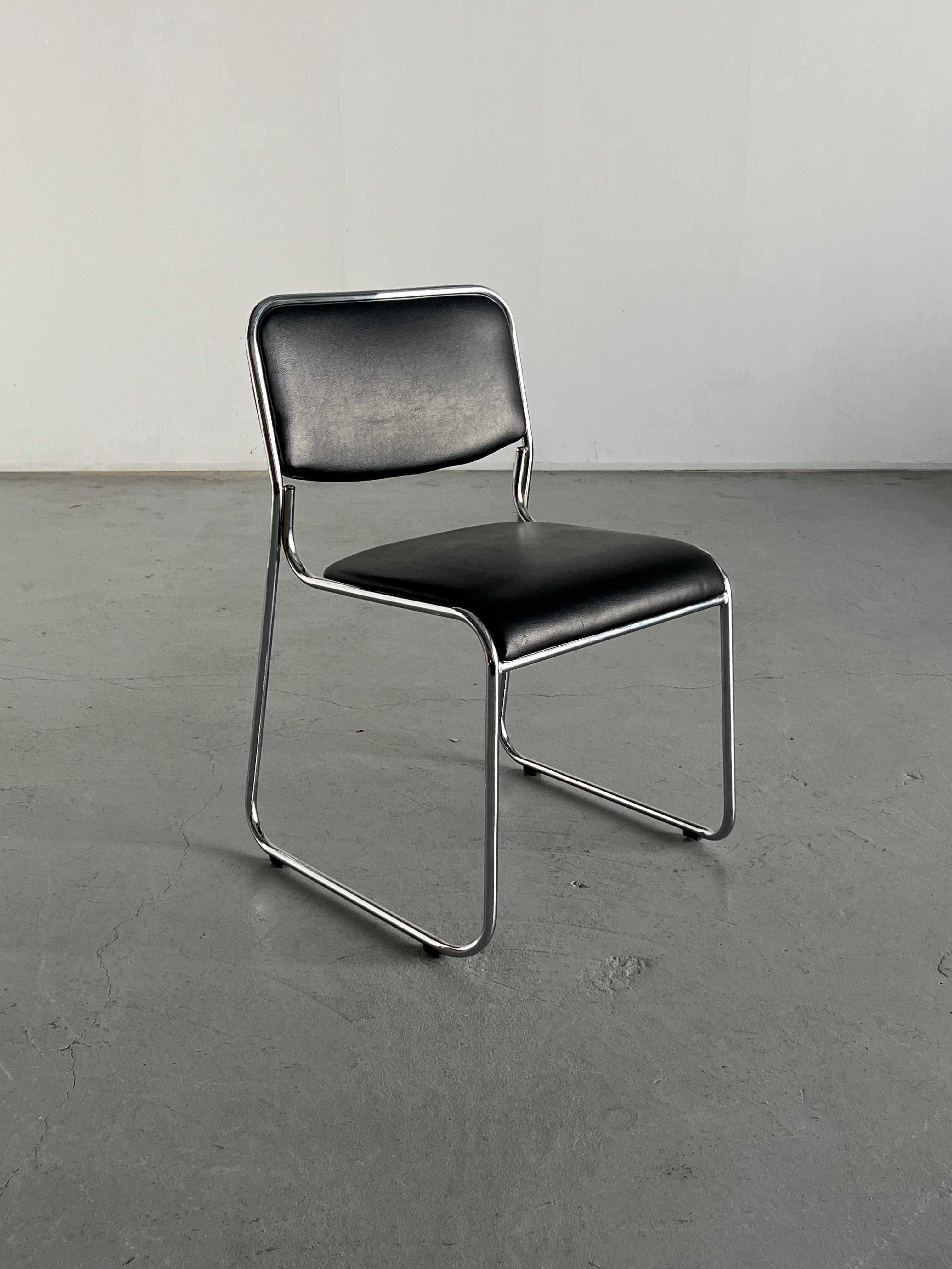 Italian modernist, Bauhaus style tubular chrome and black faux leather stackable dining or living room chair.  Italian production, 1990s. 

In good vintage condition with smaller expected signs of age. Two tiny holes on the front of the