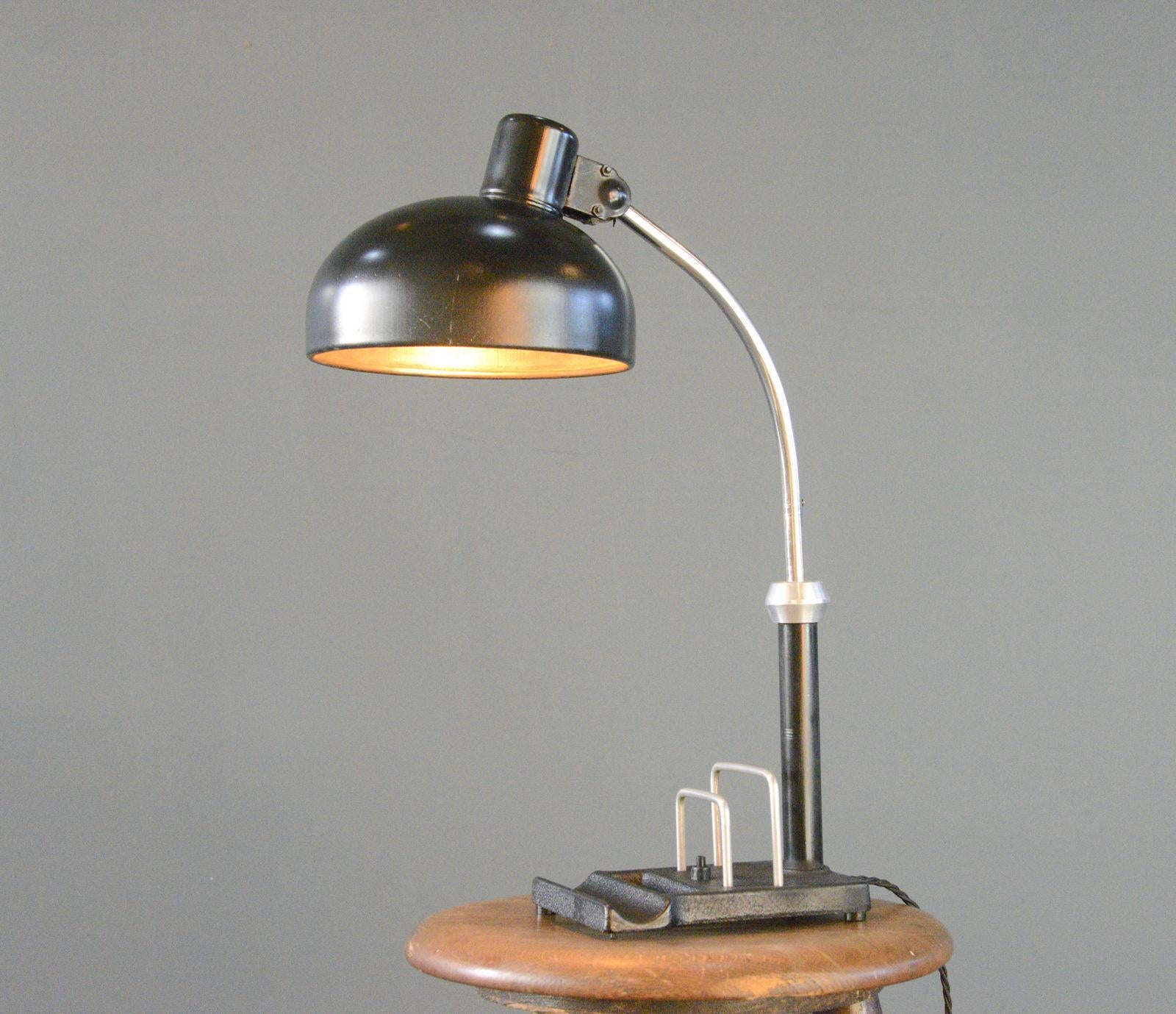 Bauhaus Desk Lamp By Christian Dell Circa 1920s

- Cast iron base with letter and pen holder
- Black steel shade
- Swing arm and adjustable shade
- Takes E27 fitting bulbs
- On/Off switch on the base
- Designed by Christian Dell
- German ~ 1920s
-