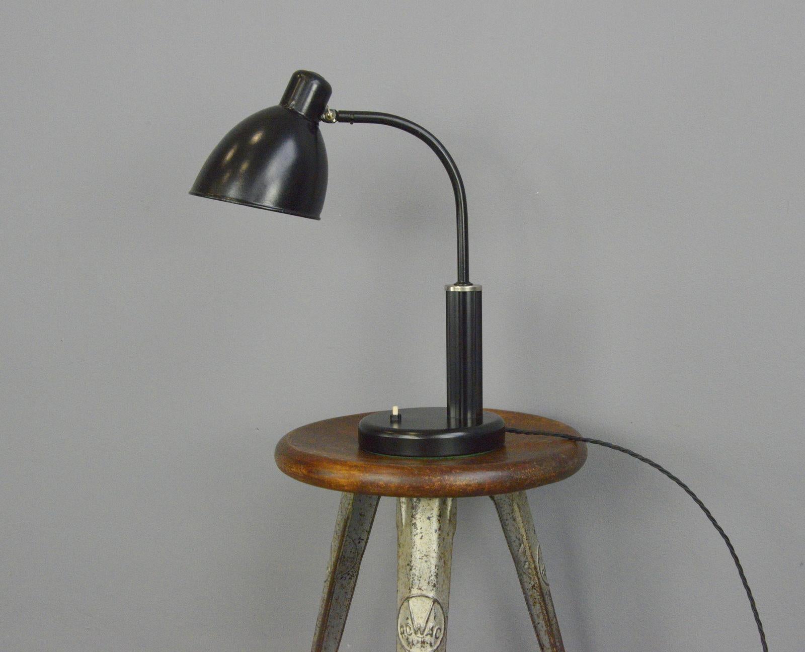 Bauhaus desk lamp by Molitor circa 1930s

- Steel shade and arm
- Bakelite handle
- On/Off switch on the base
- Concrete base
- Takes E27 fitting bulbs
- 
