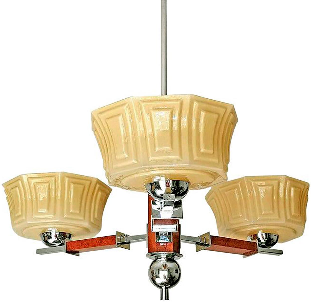 Fabulous Bauhaus French Art Deco with gorgeous opaline cased amber glass shades/chromed brass and wood 3-light chandelier.
Measures:
Width 32 in/ 81 cm
Height 28.5 in/ 72 cm
Depth 11 in / 28 cm
Weight: 7 lb/ 3 Kg
2 light bulbs E27/ good working