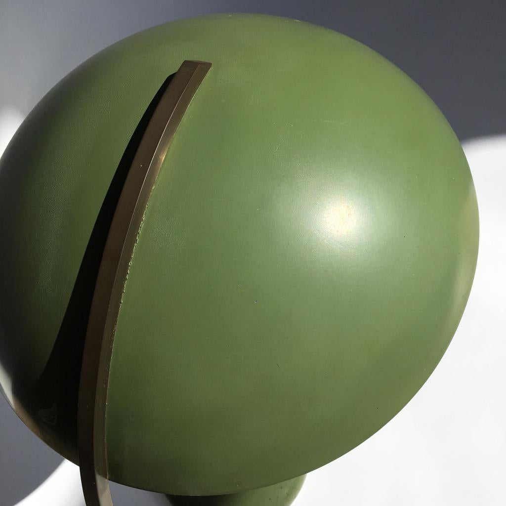 This table lamp is attributed to Hillebrand, but doesn’t have a label.

Painted metal (satin silver inside, green outside) and patinated brass connecting detail, brass socket, cotton cord. Heavy.