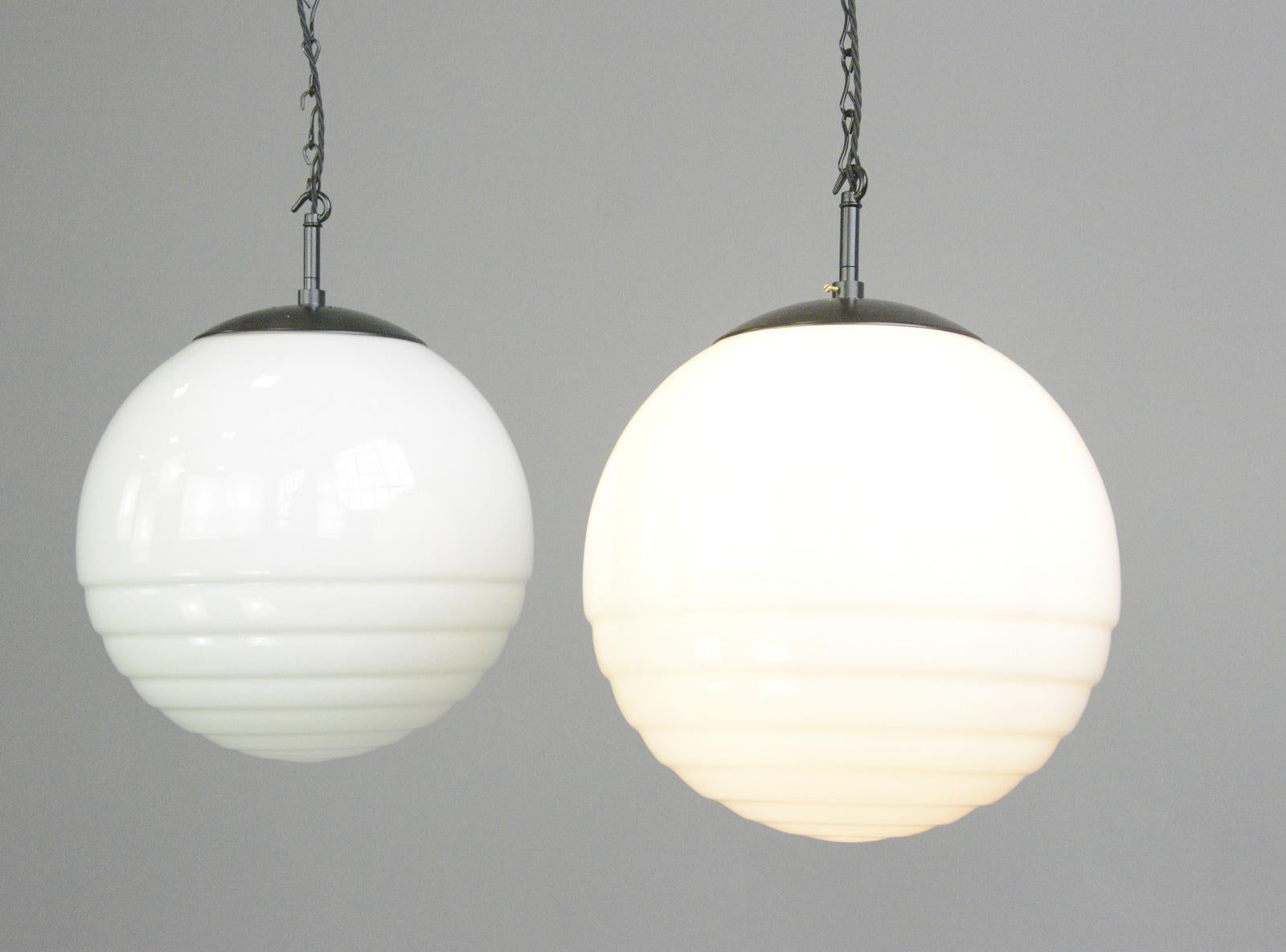 Bauhaus globe light by August Walther and Sohne Circa 1930s

- Stepped opaline glass
- Bakelite galleries and matching ceiling roses
- Comes with 150cm of cable and chain
- Takes E27 fitting bulbs
- Produced by August Walther & Sohne,