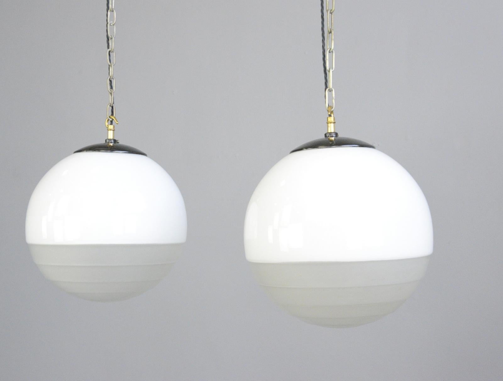 Bauhaus globe lights by August Walther and Sohne, circa 1930s

- Price is per light
- Opaline glass upper part 
- Stepped acid etched lower part
- Bakelite galleries and matching ceiling roses
- Comes with 100cm of cable and chain
- Takes E27