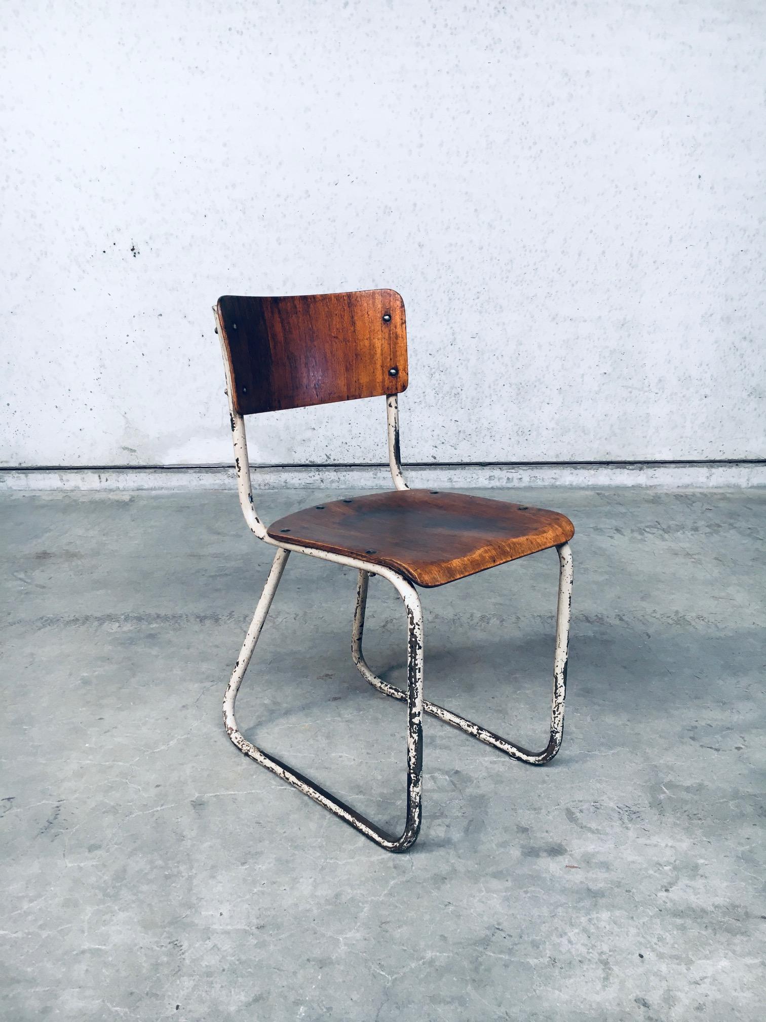 Vintage Bauhaus Industrial Design School Chair. Made in Germany 1940's period. Bend steel base with formed beech plywood seat and back rest. This chair has a very nice, well used patina. It has been refinished with keeping the original patina