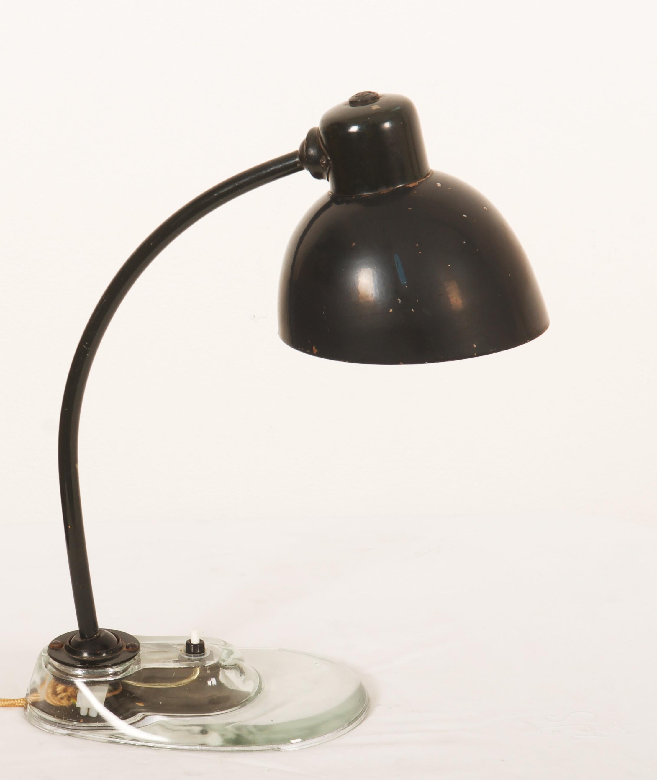 Beautiful iconic Bauhaus desk lamp designed by Marianne Brandt for Kandem Leuchtenbau Leipzig. It has the typical glass base which makes this model the much sought after one fitted with one E27 socket. Wonderful original condition with new