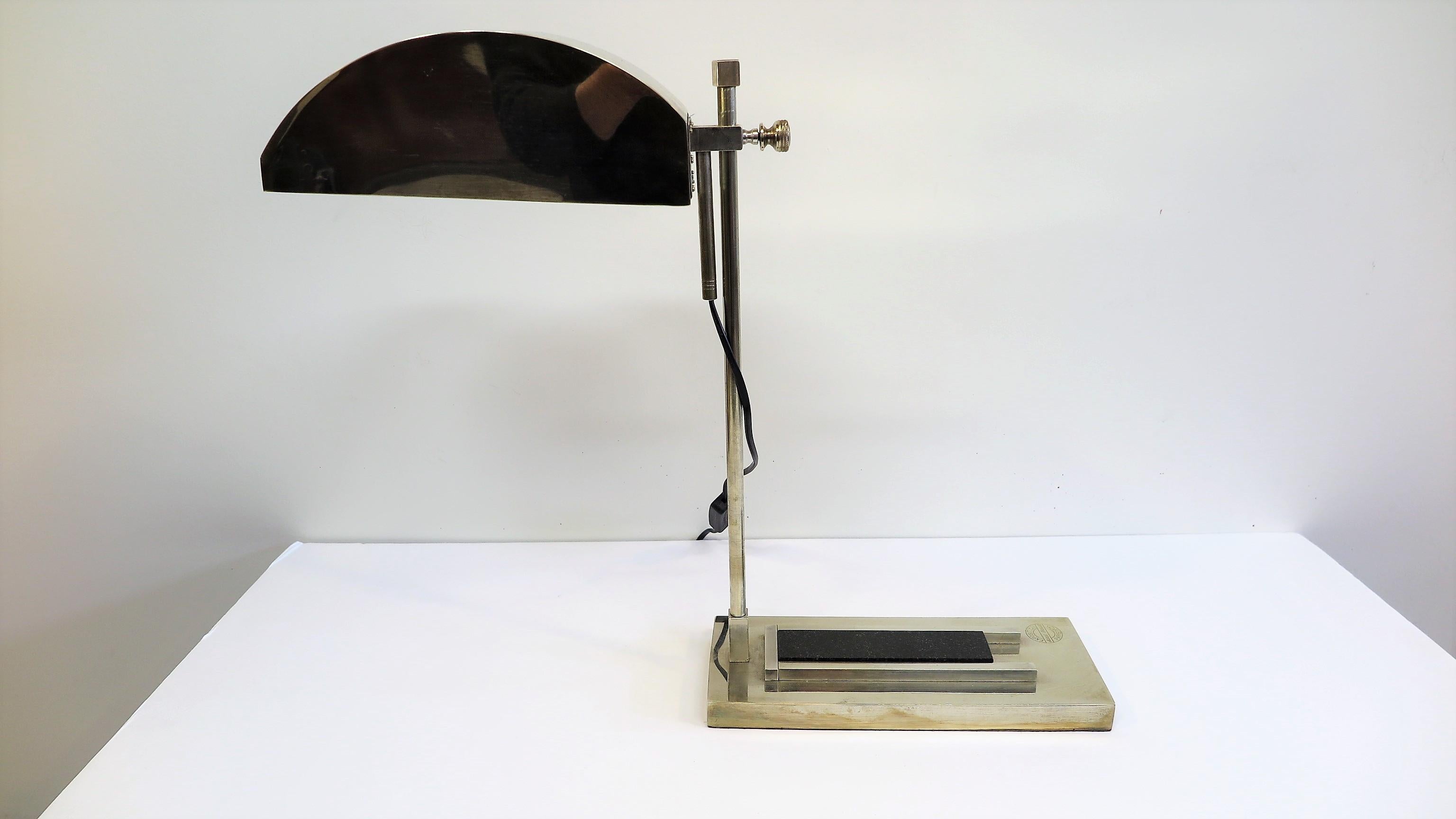 Bauhaus desk lamp by Marcel Breuer. Designed for the International Exposition of Modern Industrial and Decorative Arts, in Paris 1925, number 55 of 100. Articulating movement up and down with full 360 rotation. Composed of brass plated nickel,