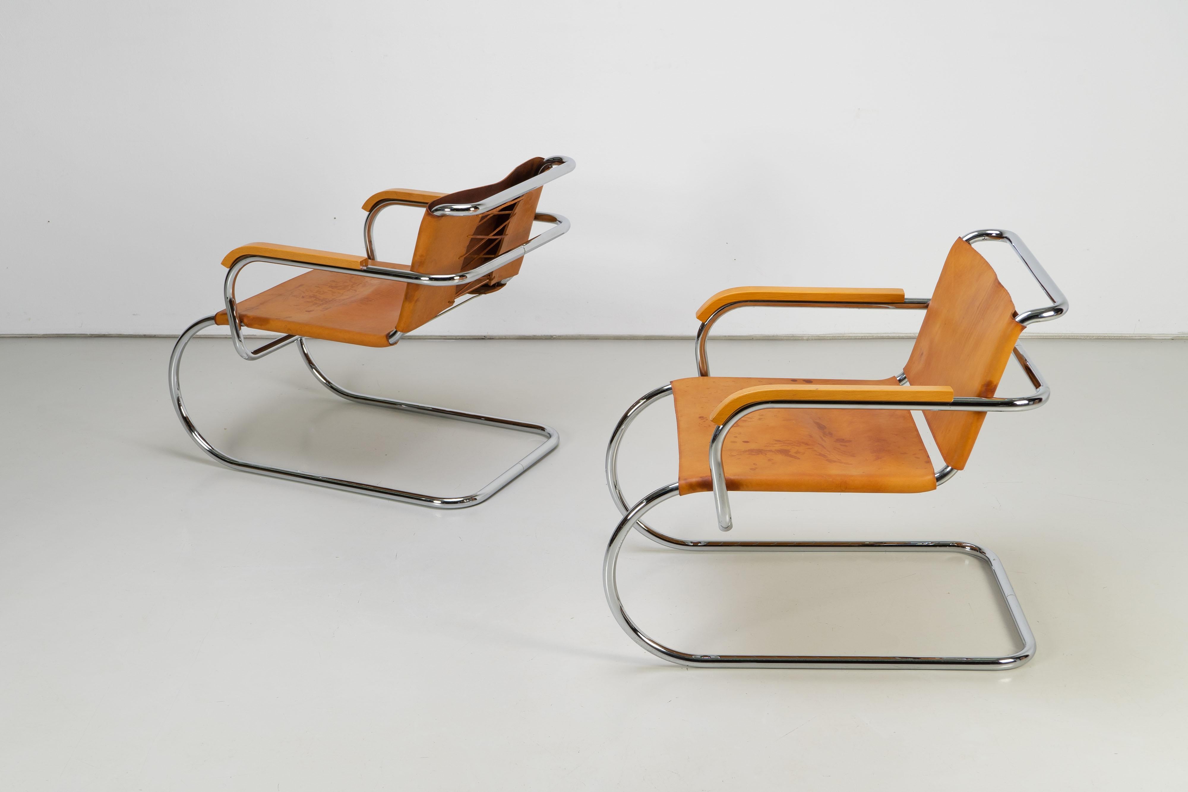 Beautifully patinated leather cantilever chairs with laced backrests, designed by Franco Albini for the 1933 Triennale. Edition from the 1970s. Price per chair.