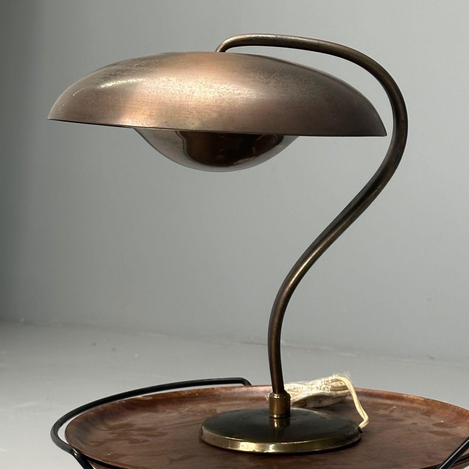 Bauhaus, Mid-Century Modern, Desk or Table Lamp, Gilt Metal, Germany, 1930s

Modernist adjustable table lamp designed and produced by BAUHAUS in Germany circa 1930s. This example has an organic form and is comprised of gilt and painted