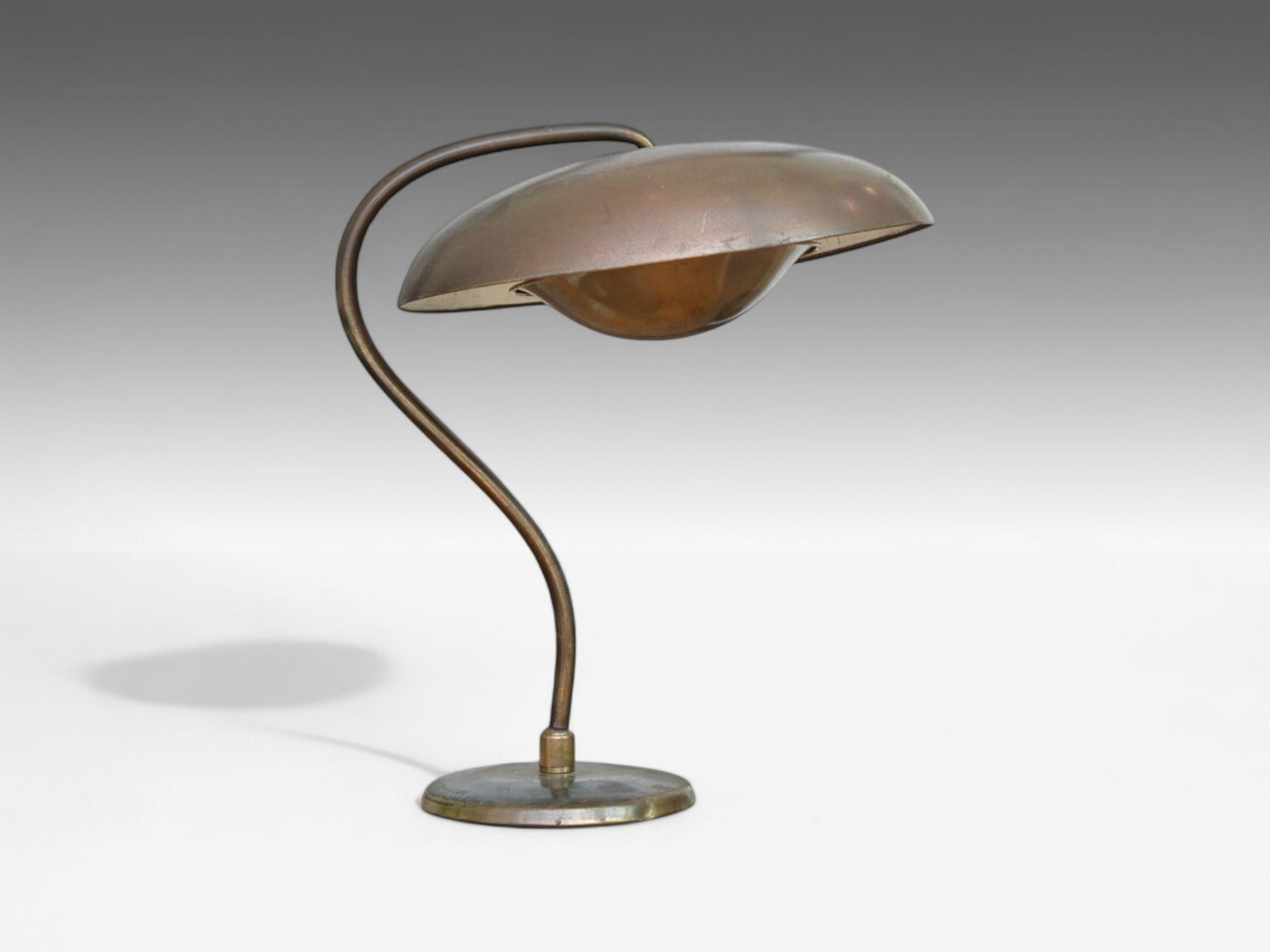 Bauhaus, Mid-Century Modern, Desk or Table Lamp, Gilt Metal, Germany, 1930s

Modernist adjustable table lamp designed and produced by BAUHAUS in Germany circa 1930s. This example has an organic form and is comprised of gilt and painted