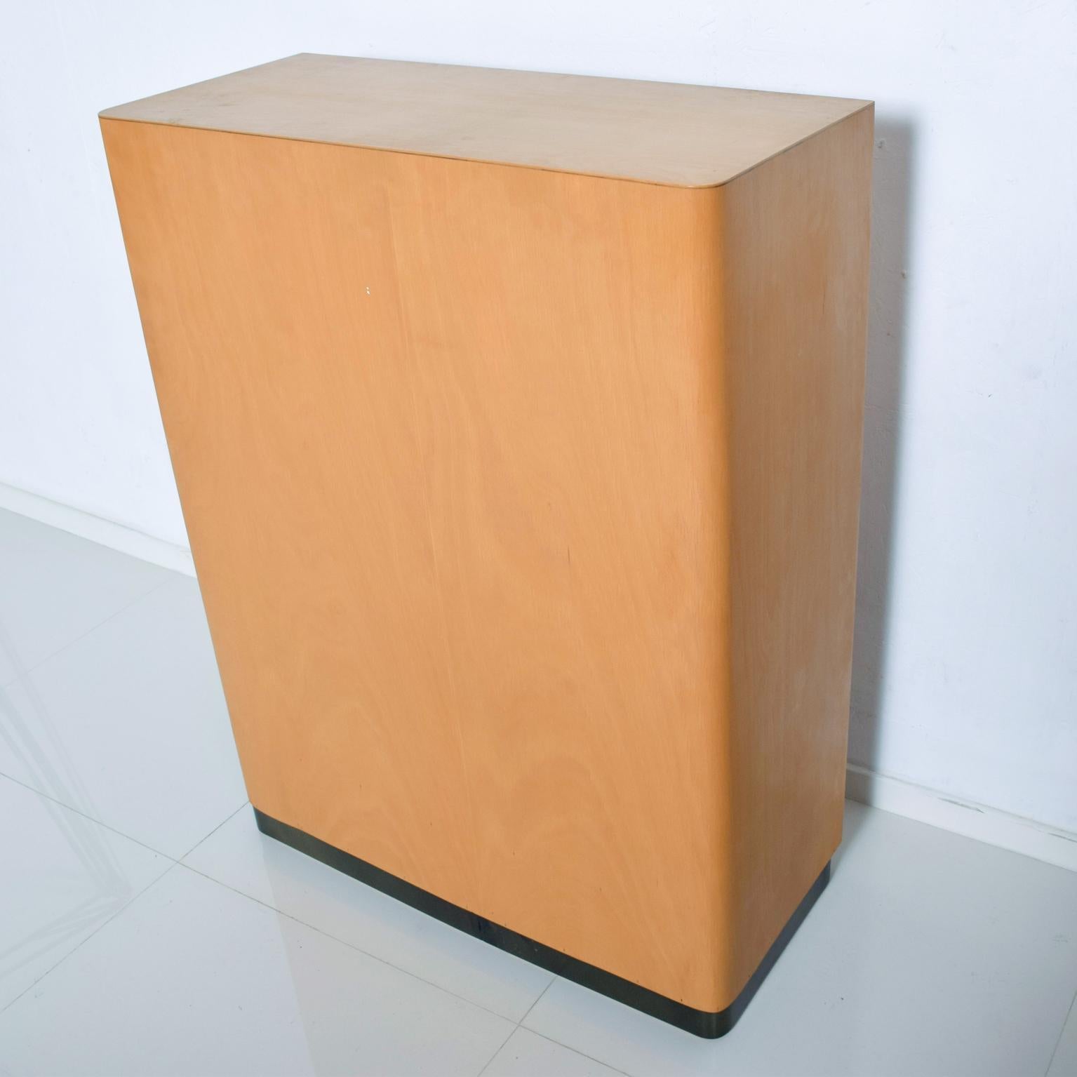 We are pleased to offer: Vintage Möbelfabrik Bauhaus Modern Filing Cabinet by Adolf Maier in Blonde Wood. Comes with Key for locking Tambour Pull up Door. Functions as a Secretary Desk.
Also available a matching blonde Bauhaus kneehole desk by Adolf