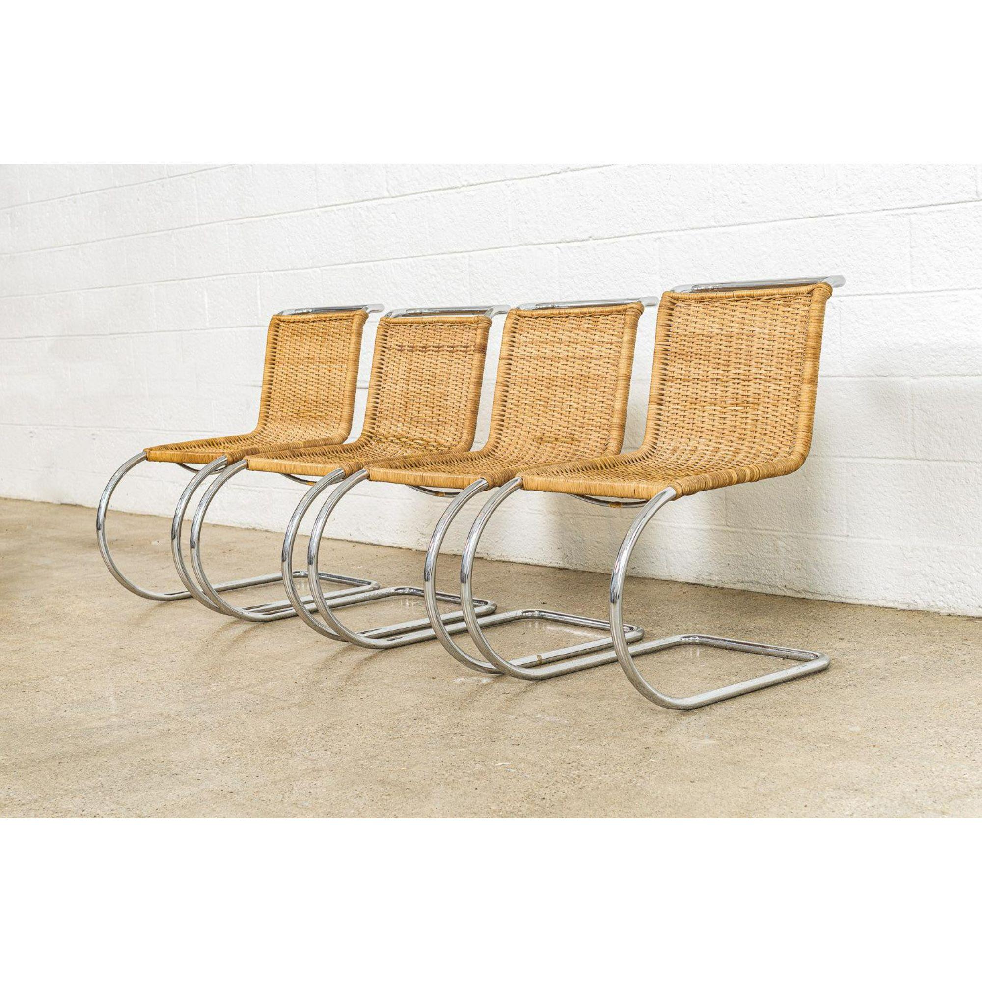 This set of vintage Mies van der Rohe MR 10 cantilevered cane side chairs produced by Stendig are circa 1970. The MR chair was designed by modernist architect Mies van der Rohe in 1927 as part of his contribution to the Weissenhof exhibit in