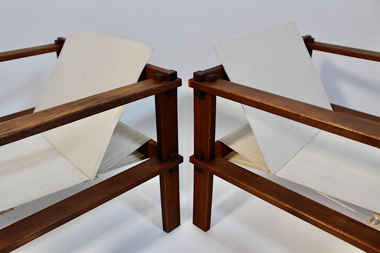 Paar geometrische Bauhaus-Loungesessel aus Buche und Segeltuch, 1920er Jahre (Frühes 20. Jahrhundert) im Angebot