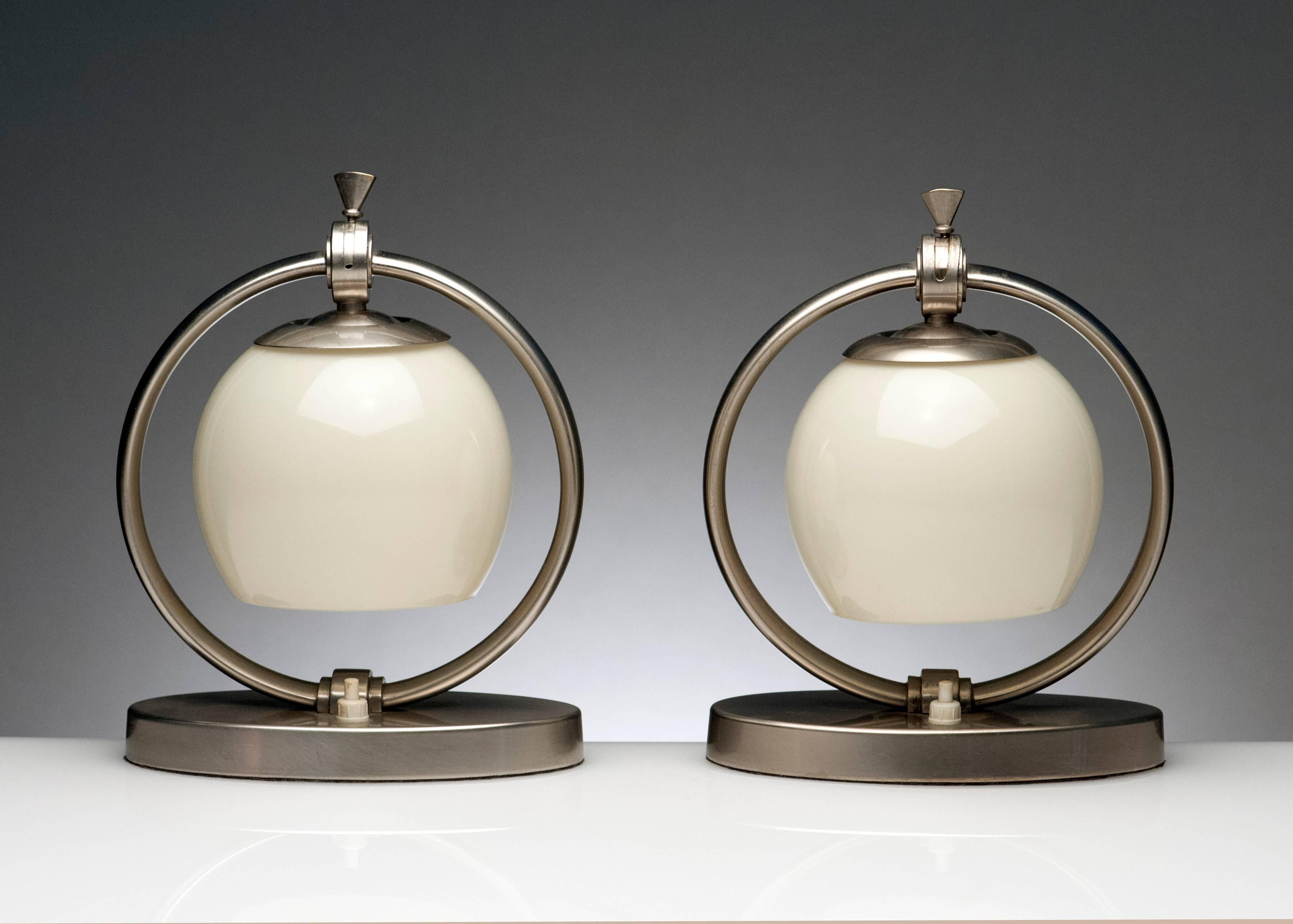 Rare pair of desk lamps by WMF of Germany. Lamps are exceptionally made and retain their original handblown glass shades.