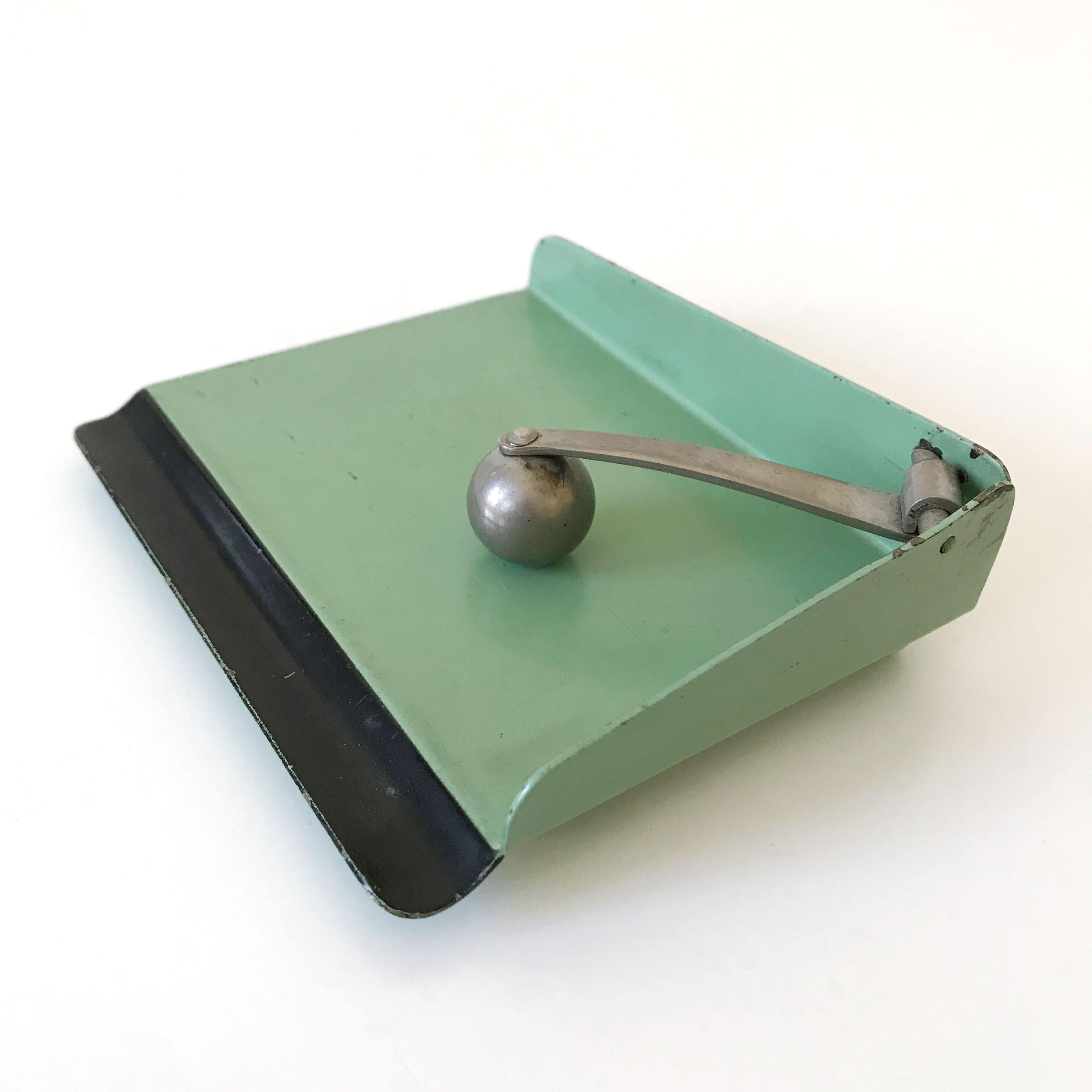 Original Bauhaus paper holder. Designed by the famous Bauhaus master Marianne Brandt for Ruppelwerk, Gotha, Germany, 1930s. A real collectors item.

This hard to find original Bauhaus piece is executed in green and black lacquered metal and
