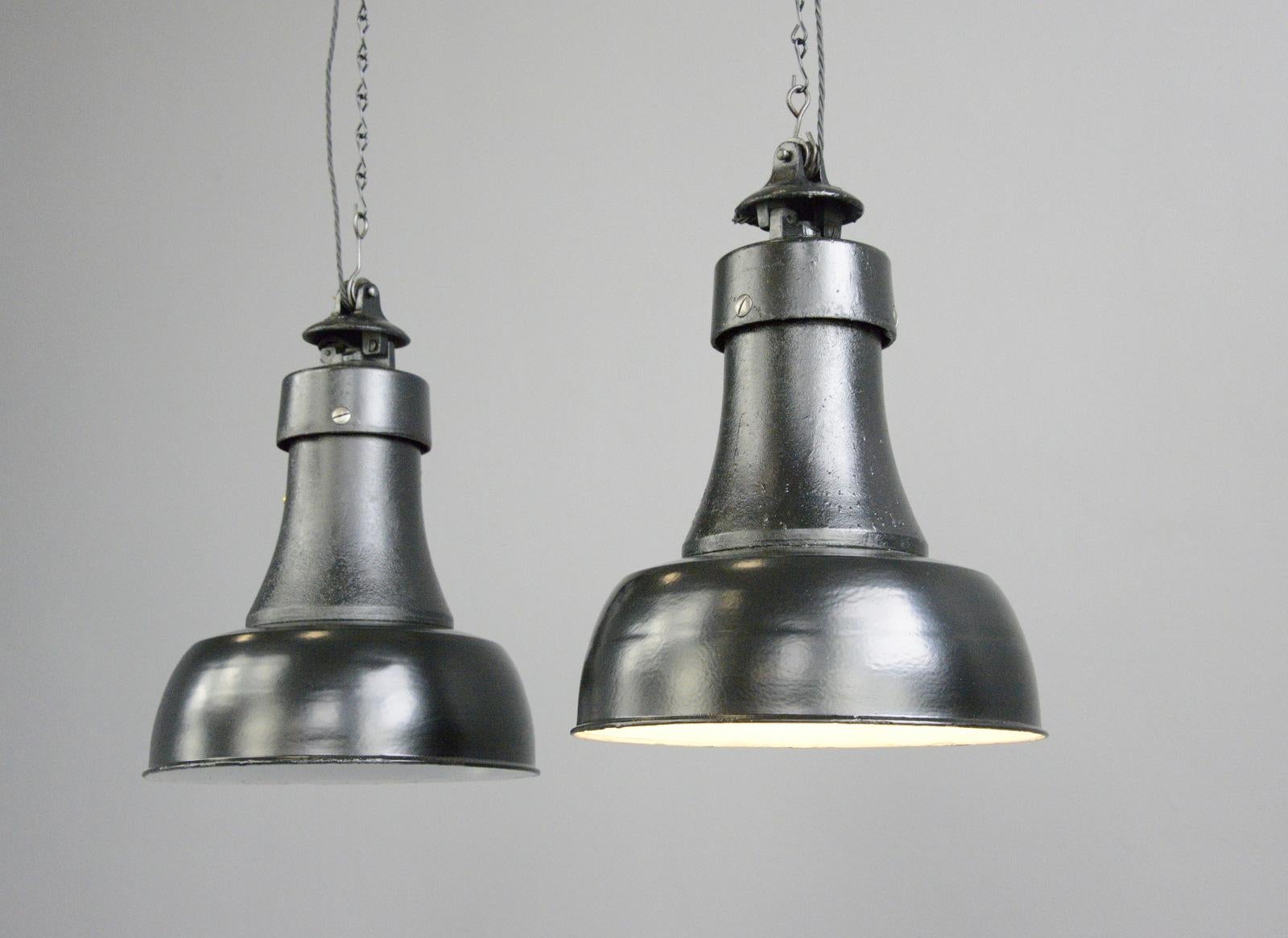 Bauhaus pendant light by Schaco, Circa 1920s

- Vitreous black enamel shades
- Cast iron necks
- Takes E27 fitting bulbs
- Cast iron and porcelain top
- Comes with 100cm of cable and chain
- Comes with ceiling hook
- Salvaged from a large