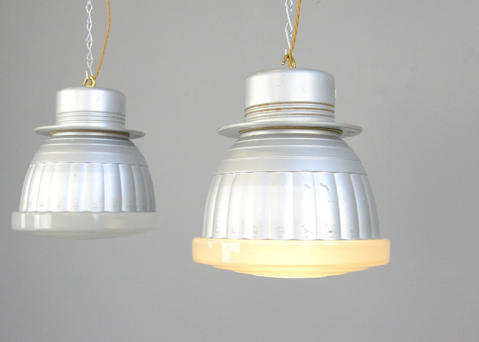 Bauhaus pendant lights by Adolf Meyer for Zeiss Ikon, circa 1920s

- Price is per light (4 available)
- Moulded glass with mercury inner reflectors
- Takes E27 fitting bulbs
- Comes with 100cm of gold twist cable and chain
- Designed by Adolf
