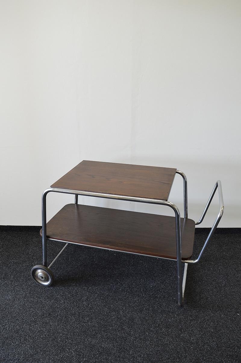 Bauhaus wooden bar or serving cart designed by Robert Slezák for Kovona in Czechoslovakia, 1940s.

Date of manufacture: 1940s
Origin: Czechoslovakia
Material: wood, chrome-plated tubular steel
Dimensions: height 71 cm x width 105 cm x depth 51