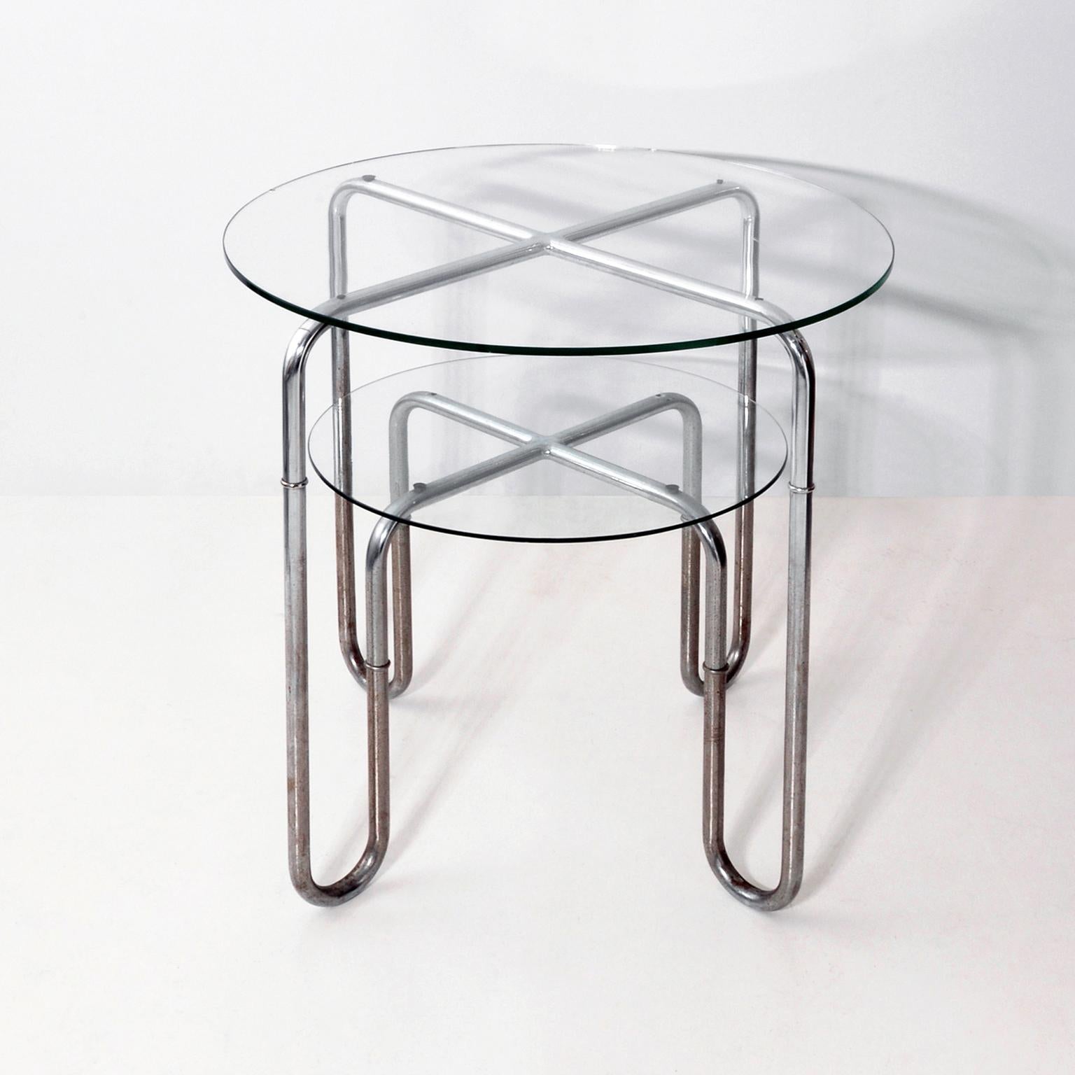 Bauhaus chrome plated tubular steel round table with glass tops. The table is attributed to Josef and Leopold Quittner, Vienna, circa. 1930.