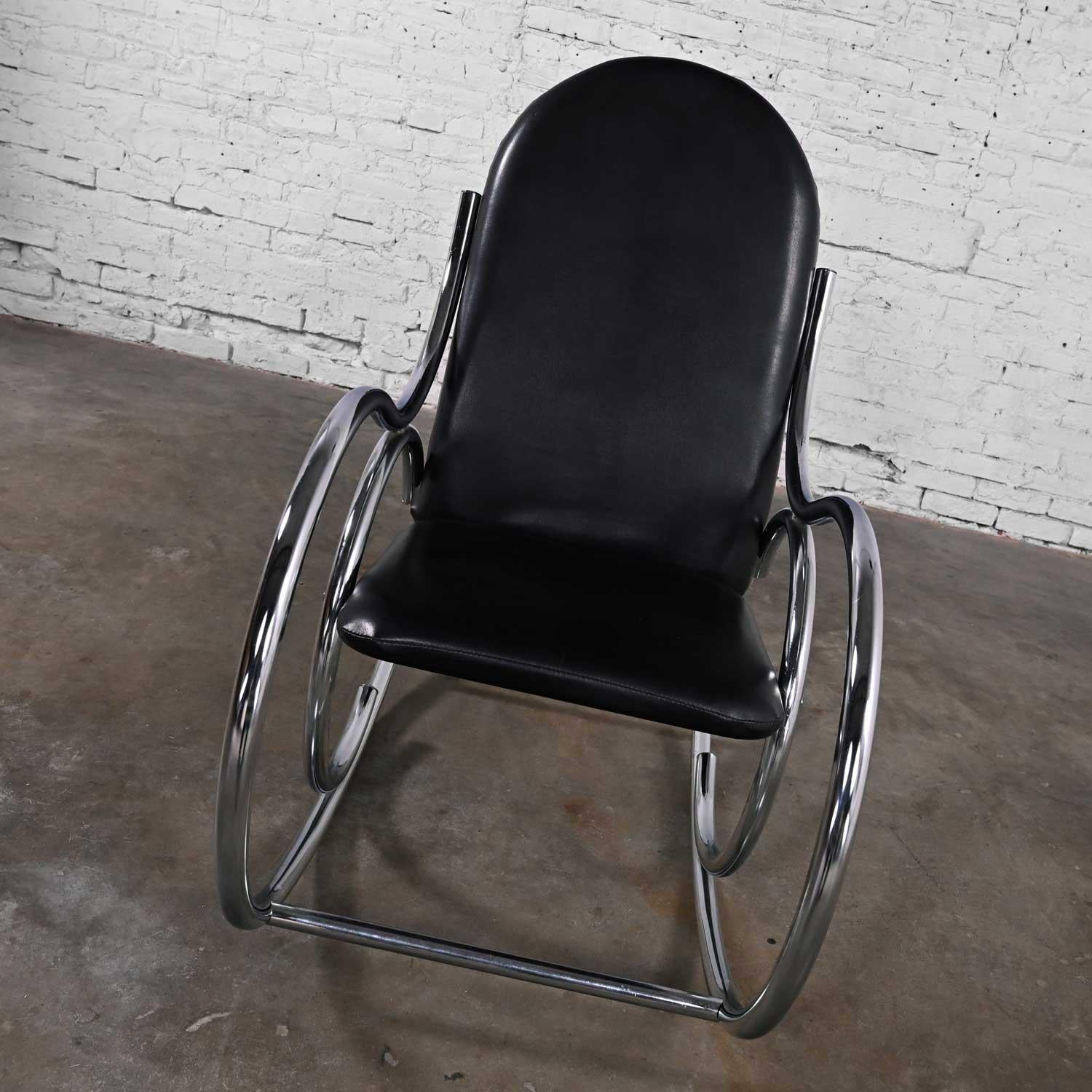 Fabulous vintage Bauhaus style black vinyl faux leather & chrome bentwood style rocking chair after Thonet. Beautiful condition, keeping in mind that this is vintage and not new so will have signs of use and wear. There are a few scuffs on the