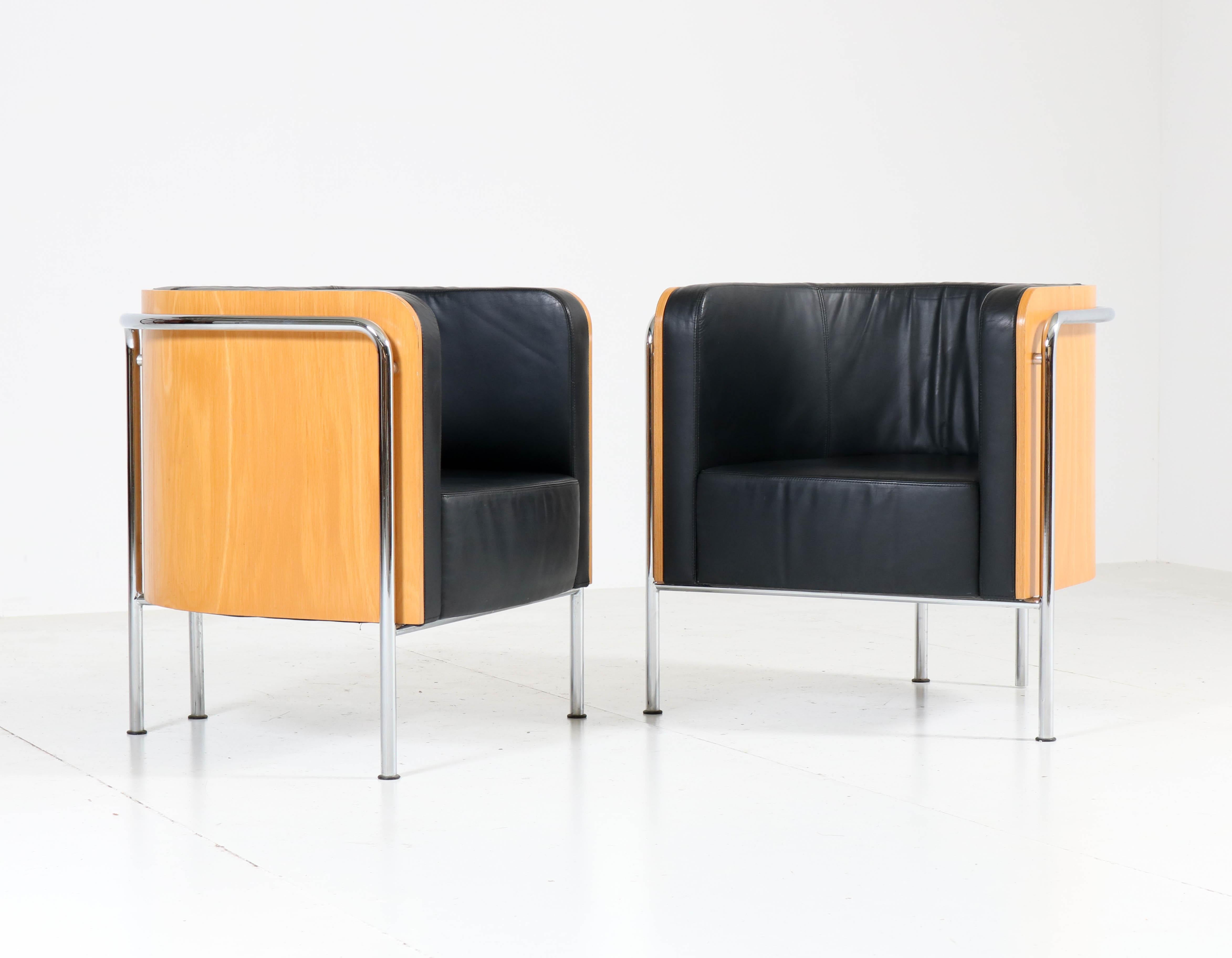 Wonderful and rare pair of vintage Bauhaus style club tub armchairs.
Designed by Thonet in 2000.
Only a few are made due to the 4500 Euro retail price of each chair!
Plywood and tubular chrome steel frame with black leather cushions.
Marked with