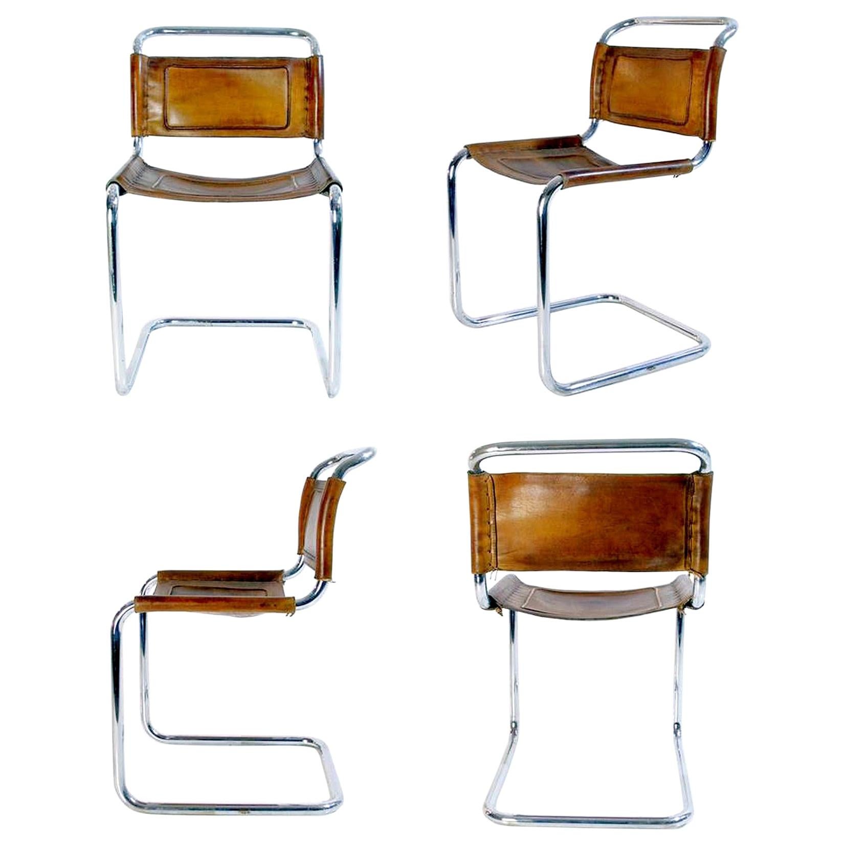 A set of four Italian dining chairs in Bauhaus style with a chrome structure with seat and back in cognac brown leather. In great vintage condition on the chrome as well as the leather. The chairs are also very comfortable to sit on for long dinner