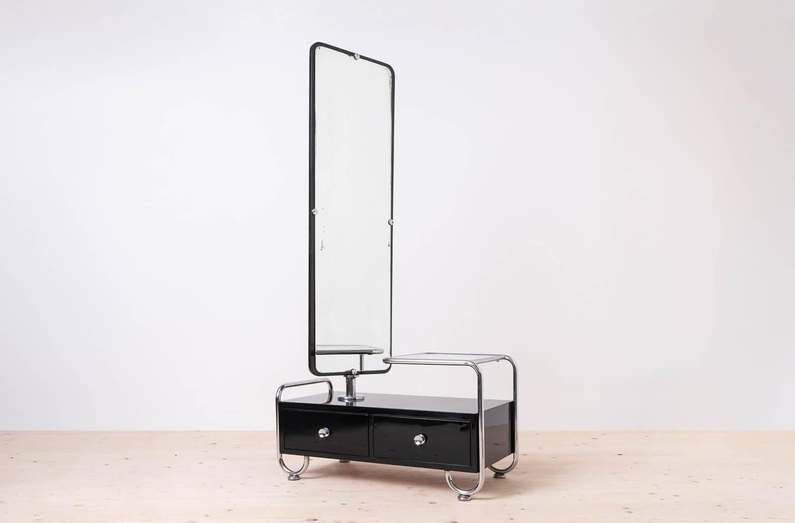 This Bauhaus style dressing table comes form former Czechoslovakia and was made around 1940s. It is a great example of simple yet very clever Bauhaus Design. The piece could have been manufactured by Vichr a Spol., Praha or Hynek Gottwald. It