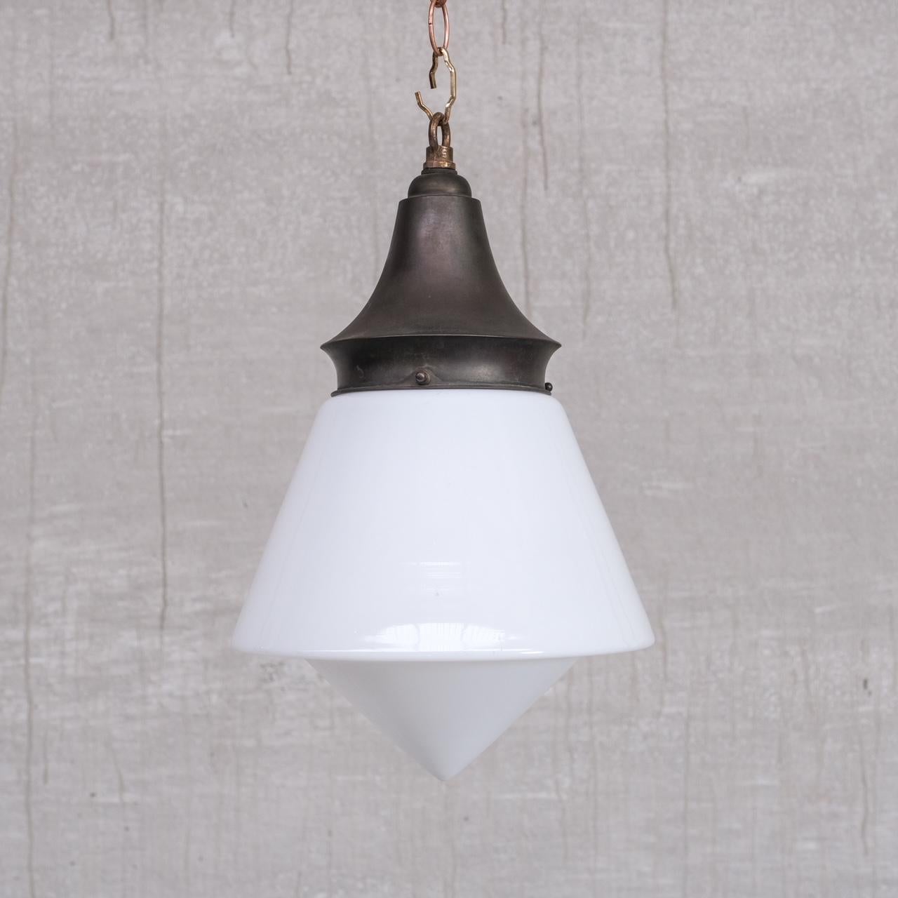 An elegant almost acorn style opaline glass pendant light. 

Germany, c1930s. 

Naturally patinated brass with glass base. 

No chain or rose was retained. We can source at cost. 

Since re-wired and PAT Tested. 

Location: Belgium