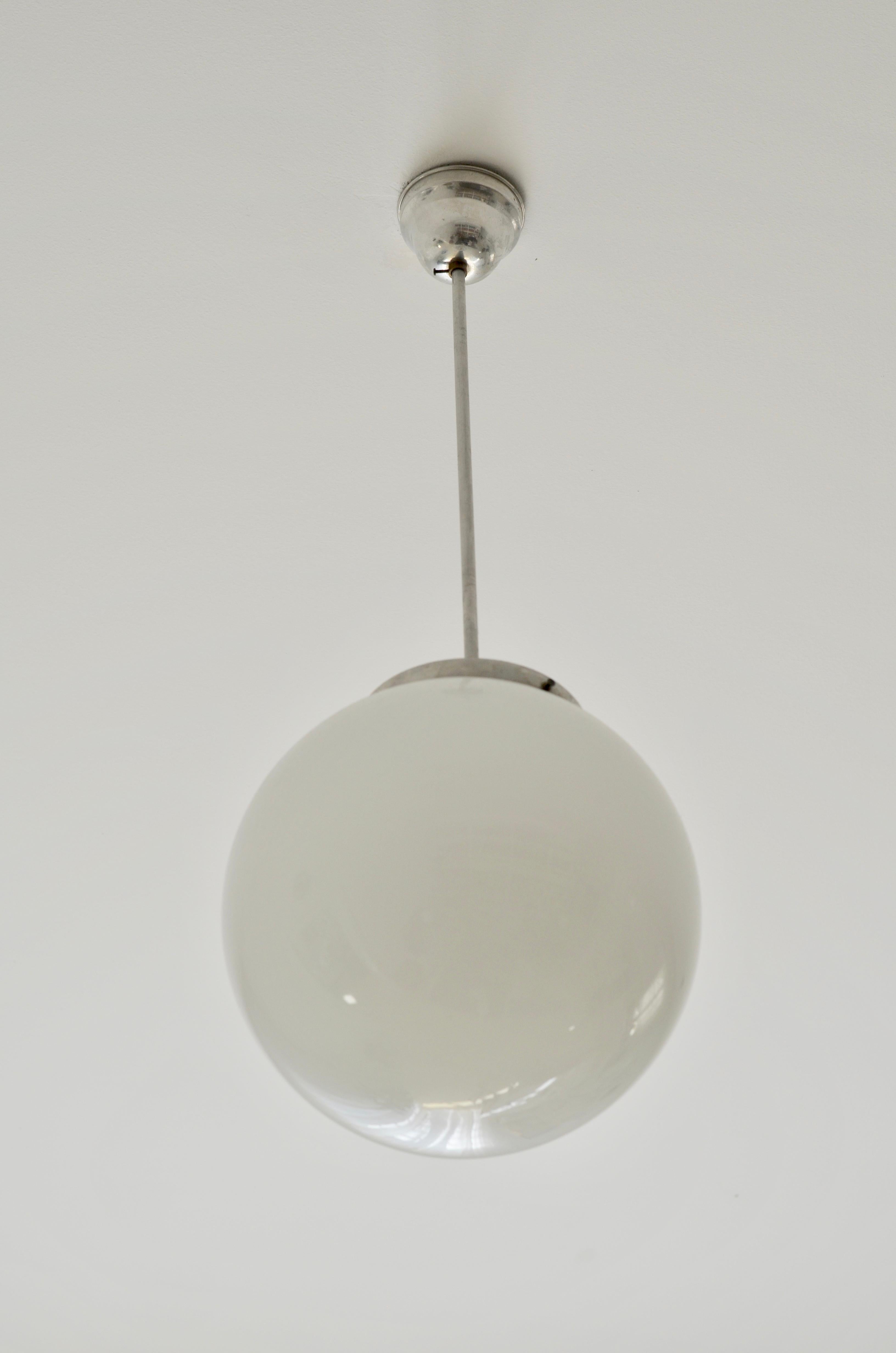 Bauhaus style pendant light.

Producer: EMI Poljcane, Slovenia, Yugoslavia.

Period of Production: 1950s.

Material: opaline glass, aluminum.

Measure: diameter: 24 cm.