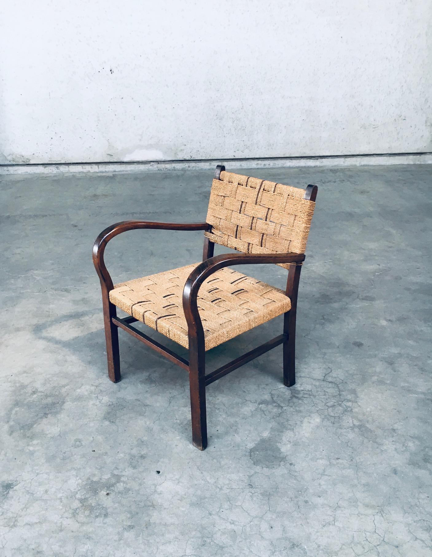 Vintage Bauhaus Period Arm Chair by Axel Larsson for Bodafors, Sweden 1930's / 1940's period. Stained beech wooden frame with twisted rope seat and back rest. Nice detailed with a darker cord that runs in the back and seat. In very good, all