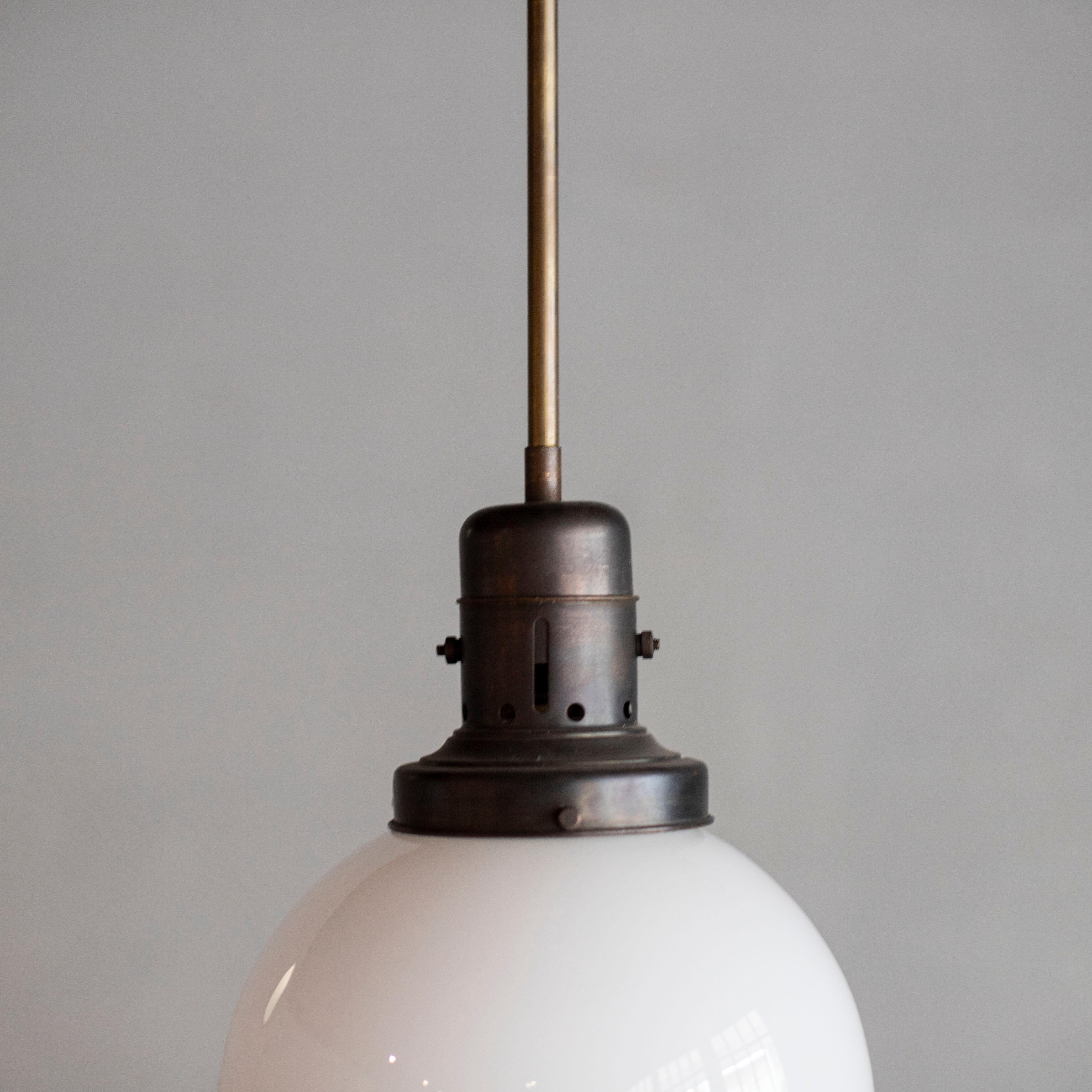 Bauhaus style pendant lamp.
One of kind.
Milk glass and brass.
Made in Italy.
Socket: E26.