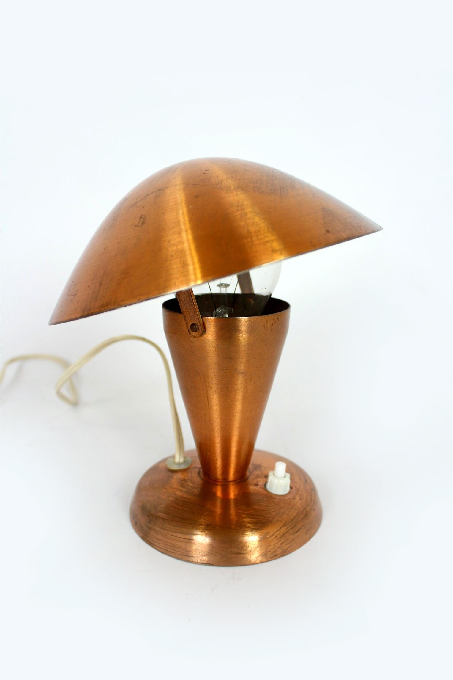 This Bauhaus style table lamp was produced by ESC in the 1940's in Czechoslovakia. The lamp is in working order, preserved in original, good condition with a visible patina.
