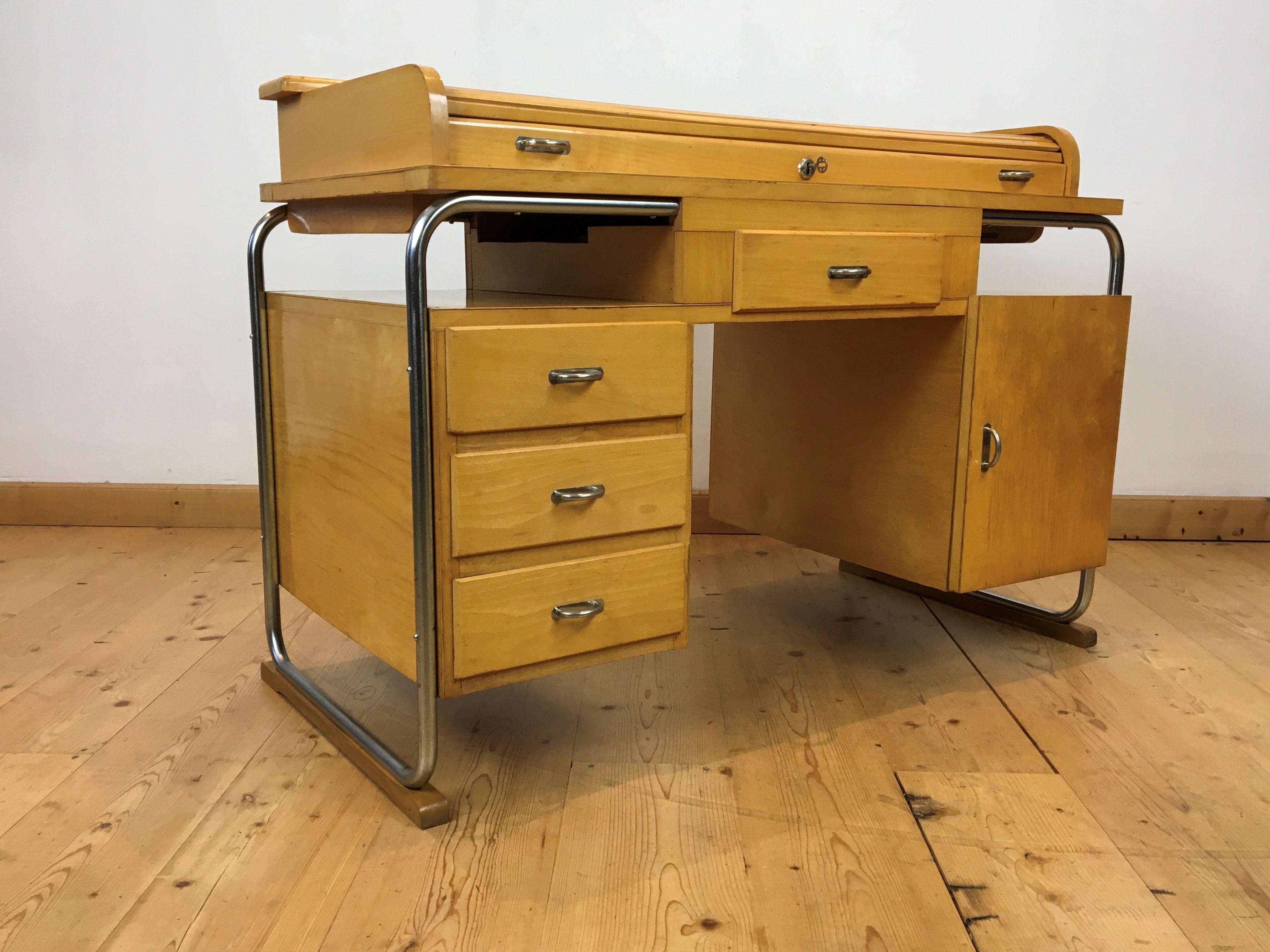Bauhaus style writing desk by Torck Belgium.
This tambour desk is made of wood with a tubular chromed frame.
The design and shape of this desk is amazing. 
Can be used as a desk but also as a wall table or console table as it has a  beautiful shape.