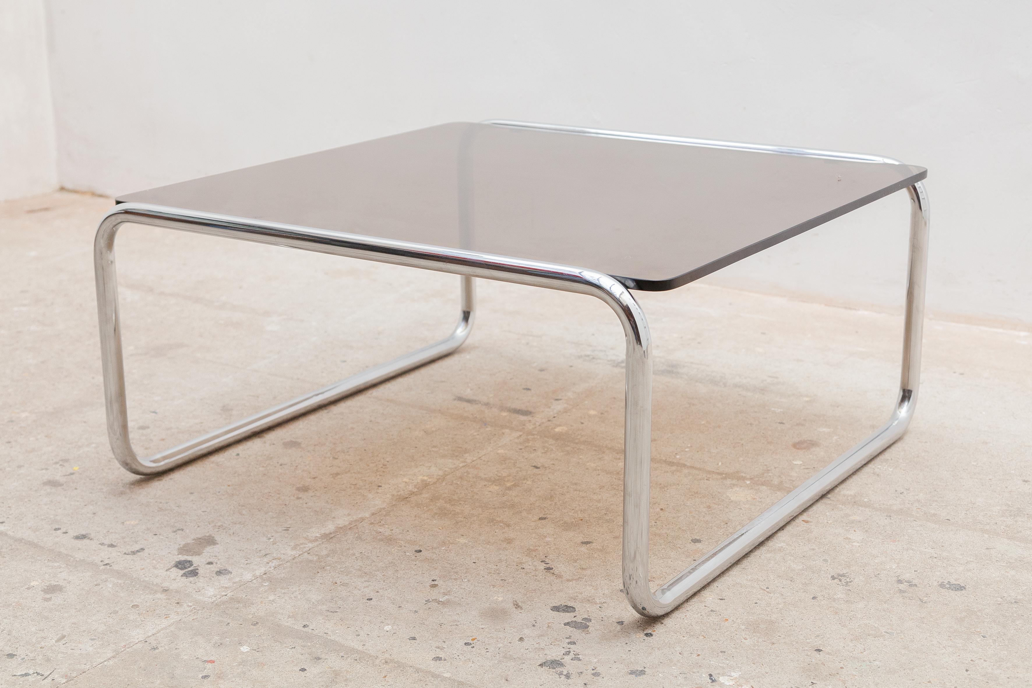 Bauhaus style seventies design coffee table features in chromed tubular frame with a smoked glass top, this coffee table is in a very nice quality, very suitable as a side table by sofa or as a solid plant table, console. Also available a large