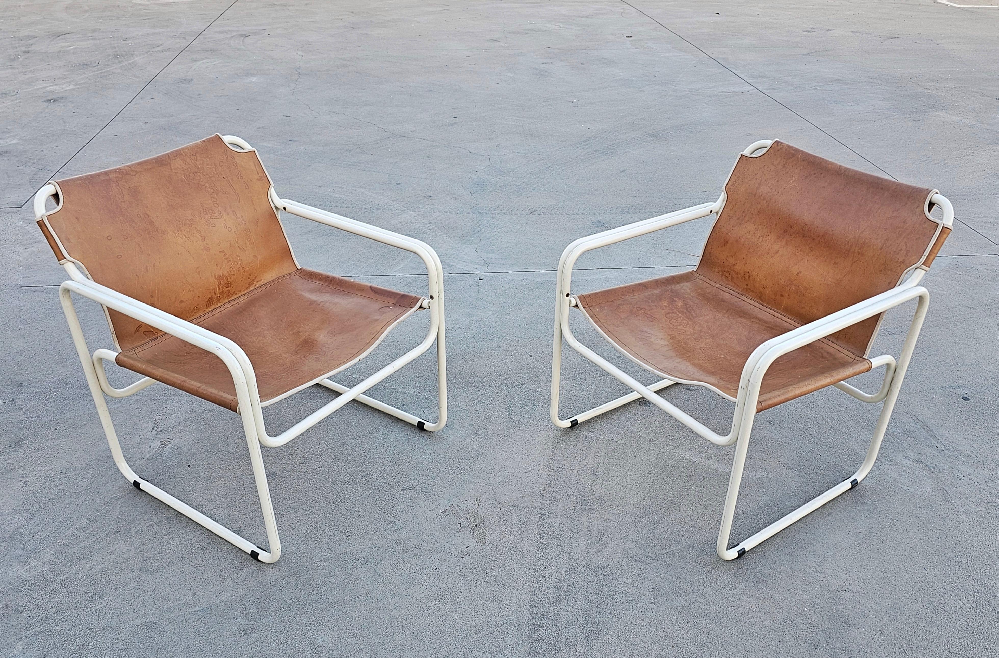 In this listing you will find a pair of Bauhaus Style Tubular Leather chairs manufactured by Jox Interni. They feature off-white frames and cognac leather seats. Made in The Netherlands in 1970s.

Good vintage condition with some signs of time and