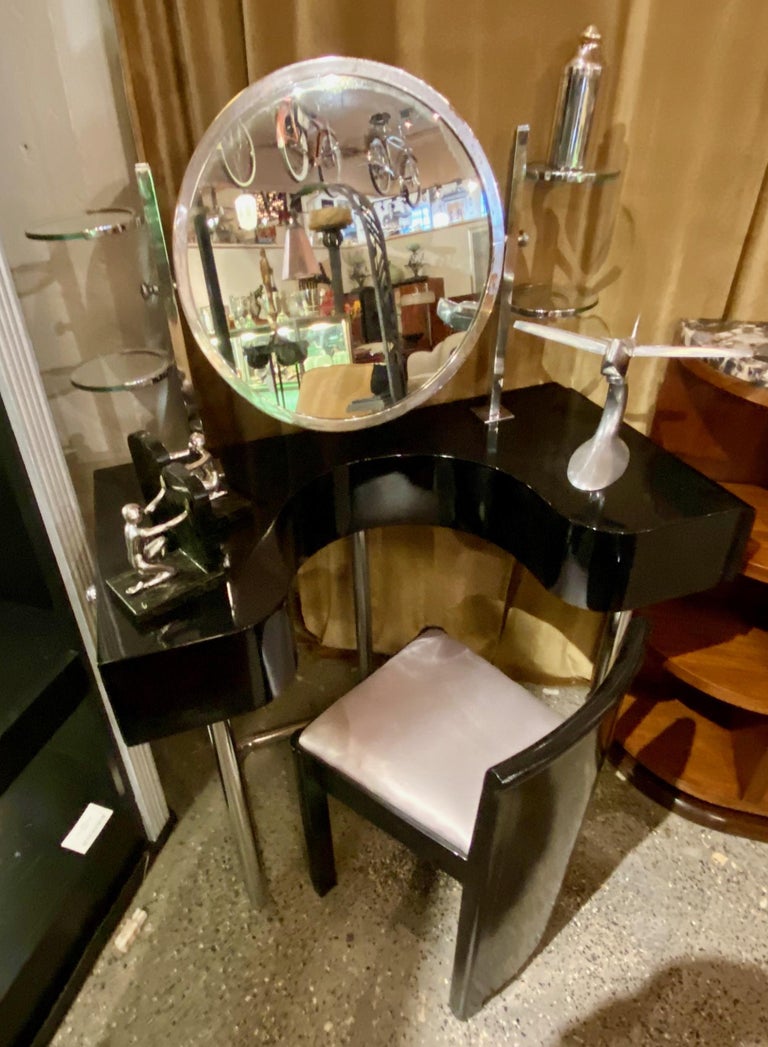 Bauhaus vanity, mirror and black lacquer chair streamline furniture set. Aerodynamic style is characteristic of the industrial and domestic design of the late 1920s and 1930s. European origin set could possibly be from Germany or Bohemia. The vanity