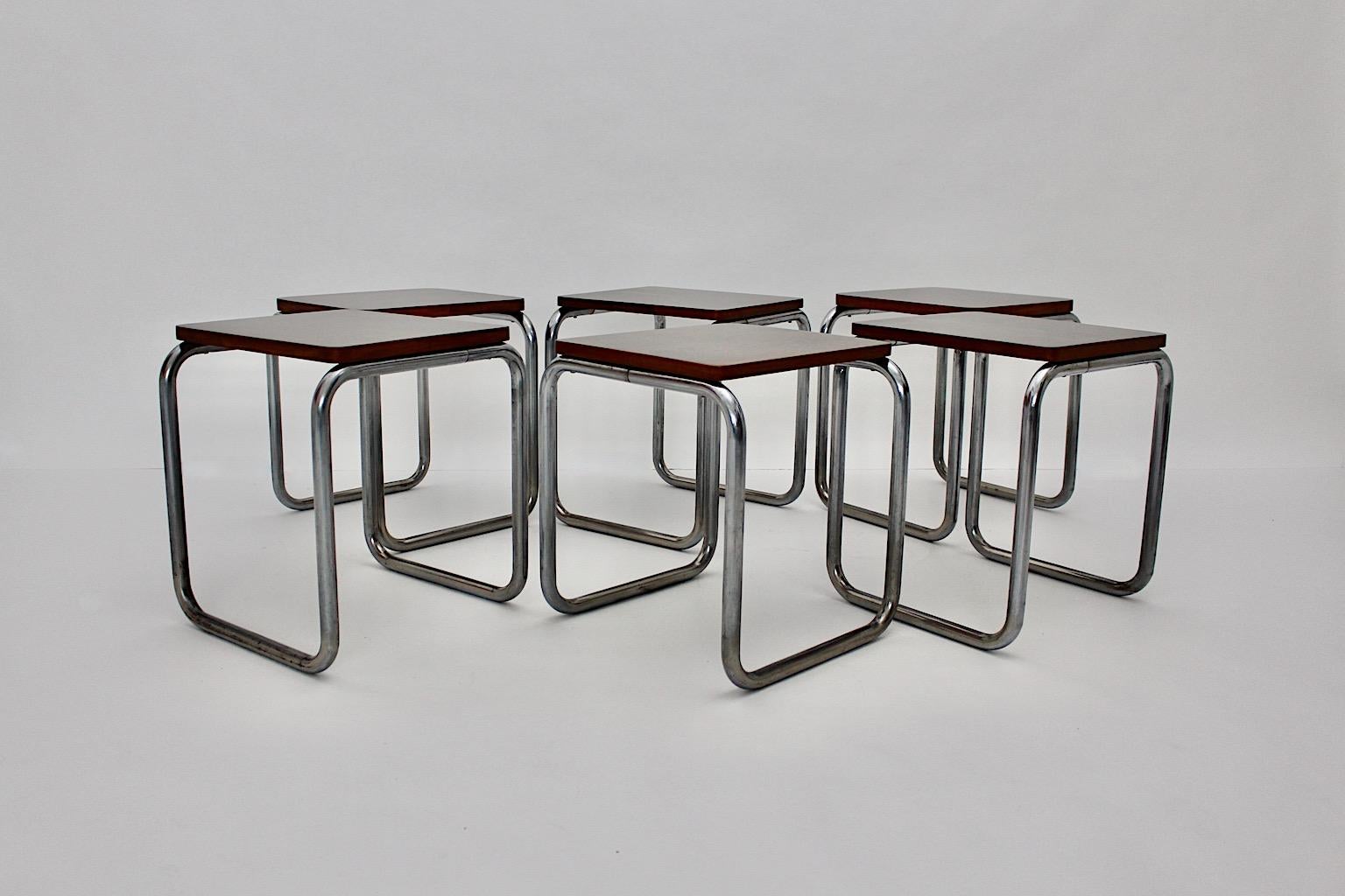 Bauhaus Style vintage set of six stools by Karl Fostel´s Sen Erben for Sonett Internationale Wortmarke from chromed tube steel and walnut veneered plywood 1930s Austria.
A sophisticated Bauhaus style design rectangular chromed steel frame with