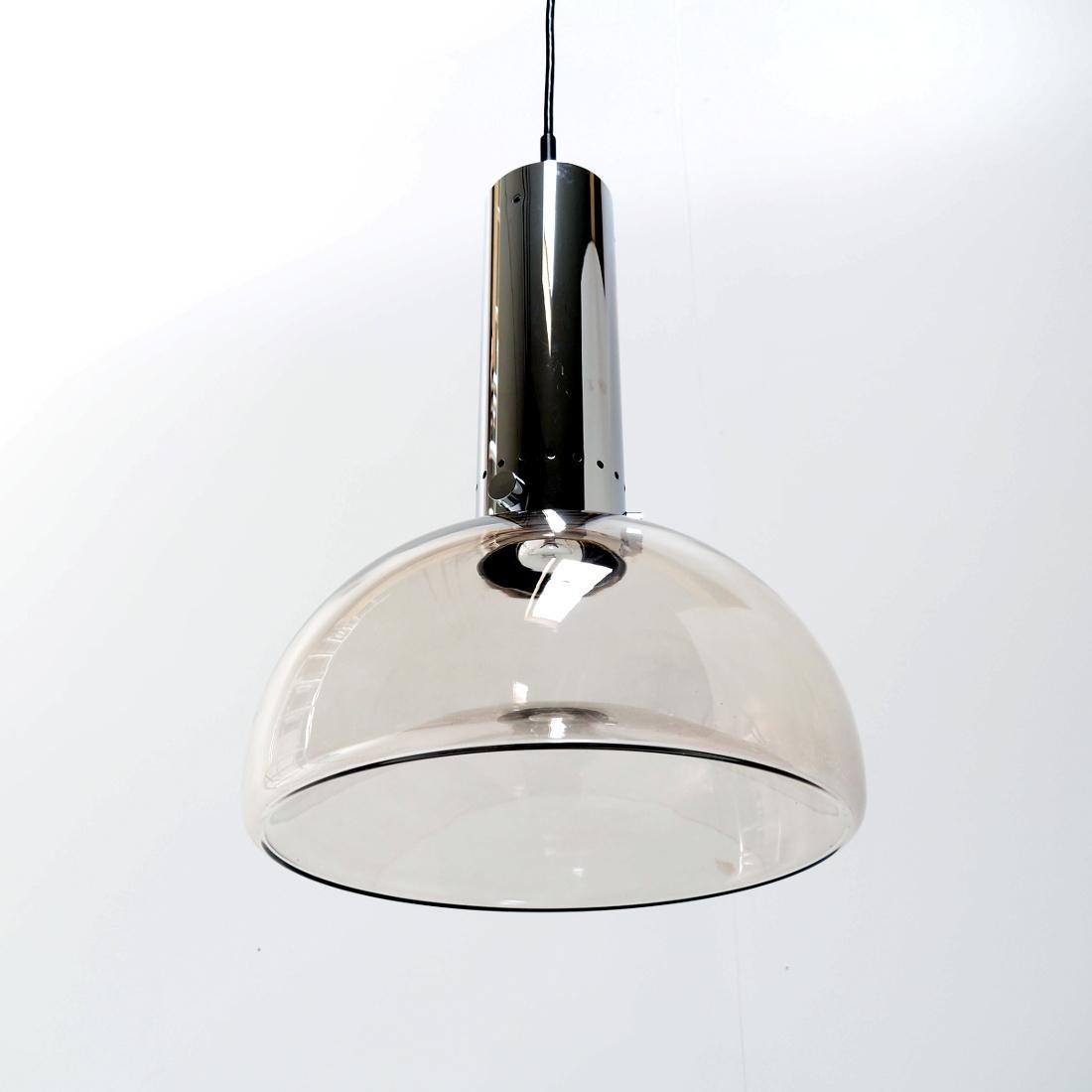 Pendant designed in the 1970’s by Herbert Proft for Glashütte limburg. The lamp is very elgantly finished and very much designed in the Bauhaus style. It won the IF Design Award in 1974.

The crystal glass and chrome are in absolute perfect