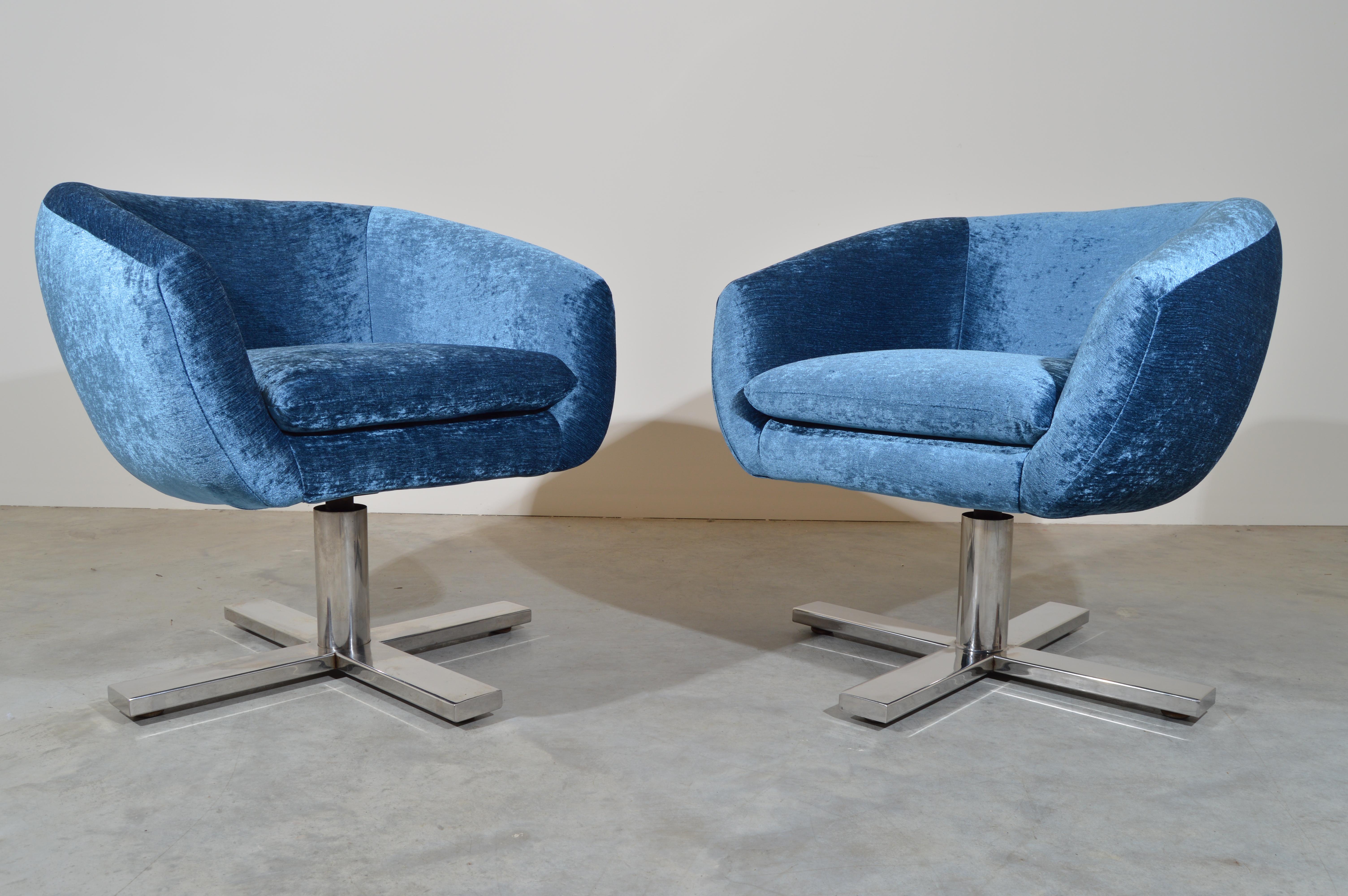 A rare pair of mid-century swiveling pod chairs by Edward Axel Roffman in smooth blue tone velvet. Incredibly soft and comfortable. The swivel action works perfectly and the Crypton fabric and cushioning are new. Original tags are still in place.