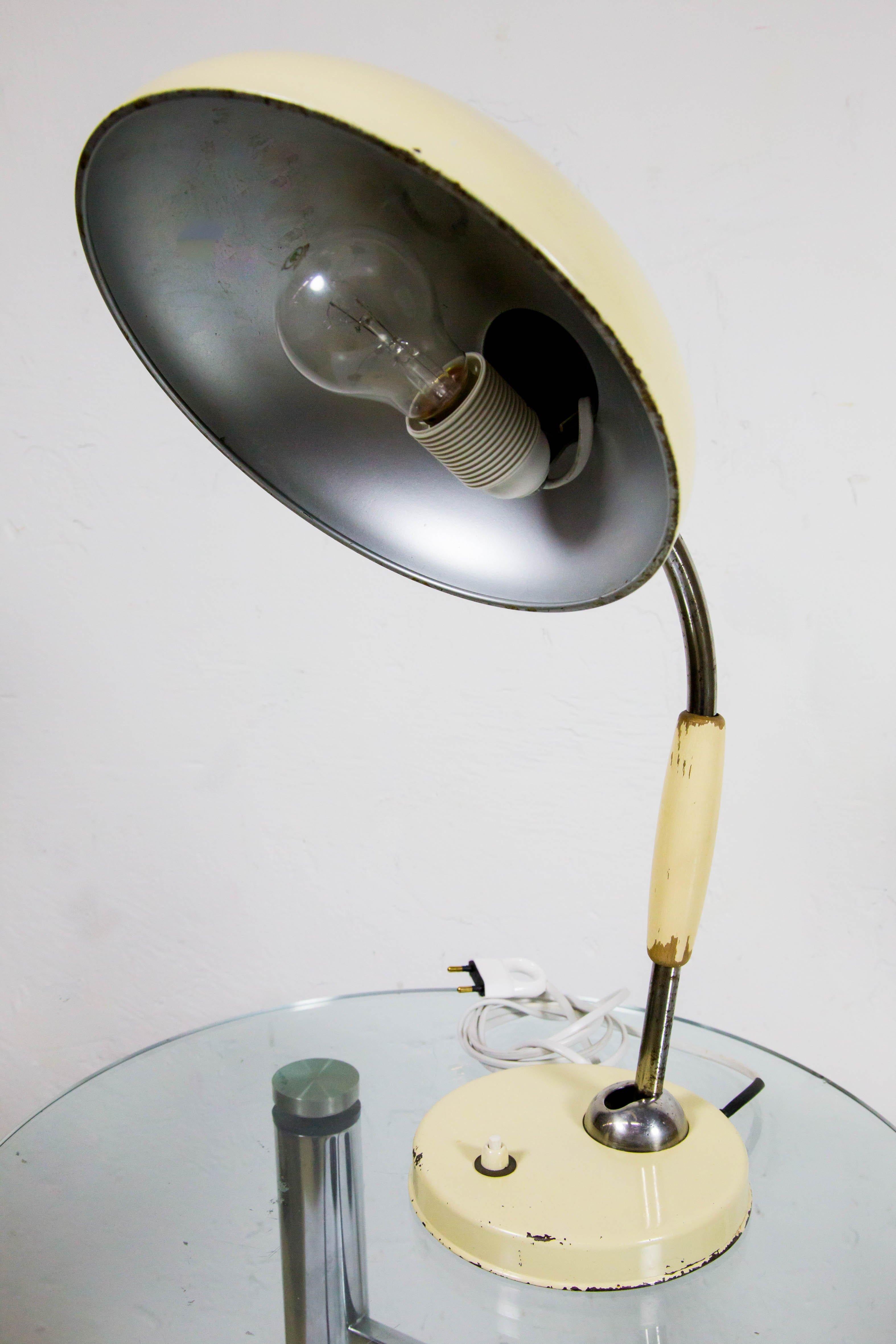 Vintage Bauhaus table lamp by Christian Dell for Koranda. This piece is a well-known design that is well documented in general design literature.
Designed circa 1938, this table lamp was produced by Koranda in Vienna around the 1940s-1950s. It is