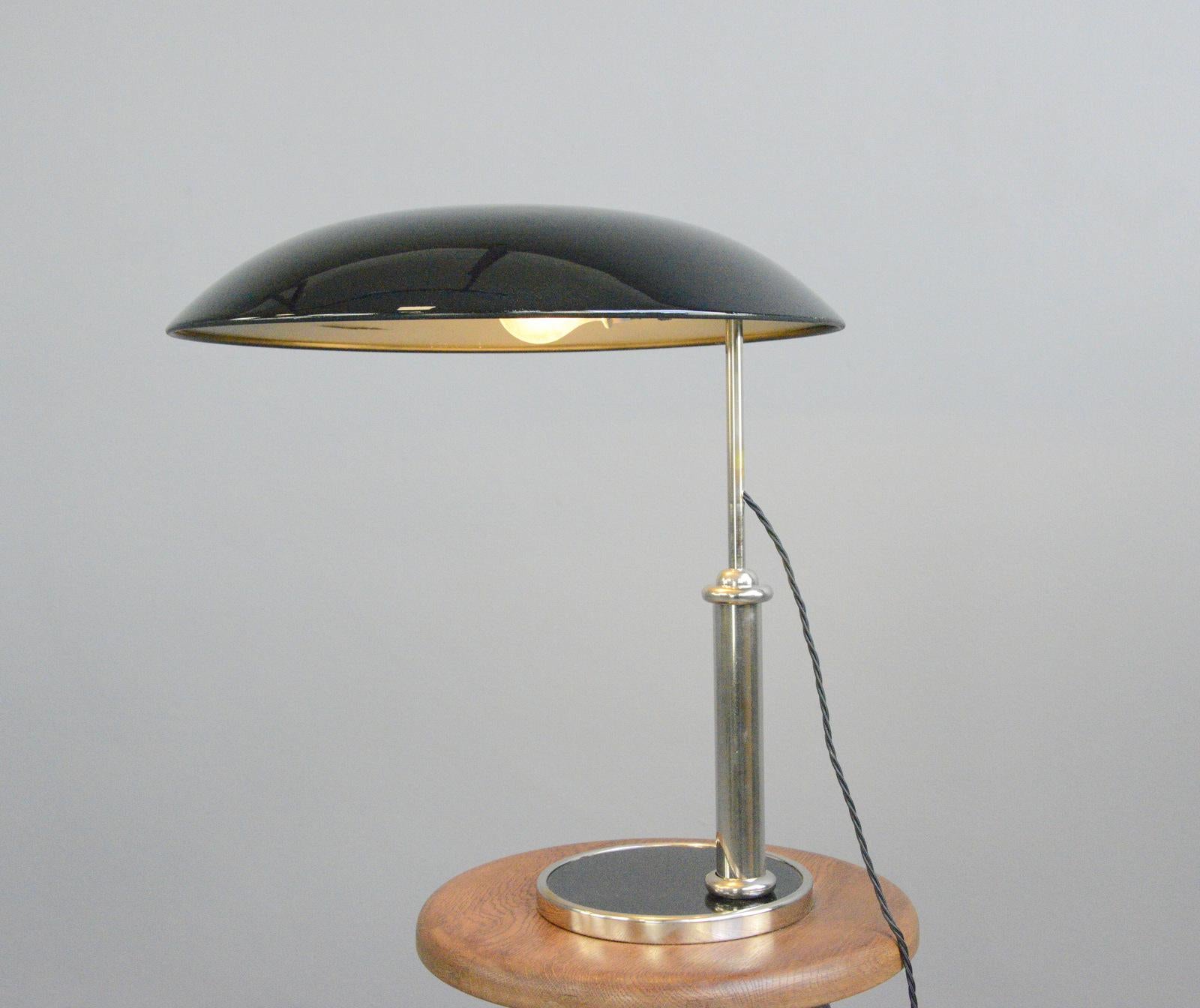 Bauhaus table lamp by Hala Circa 1930s

- Steel shade
- Nickel arm 
- Height adjustable
- Takes E27 fitting bulbs
- On/Off toggle switch on the bulb holders
- Made by Hannoversche Lampenfabrik
- German ~ 1930s
- measures: 50cm tall x 45cm